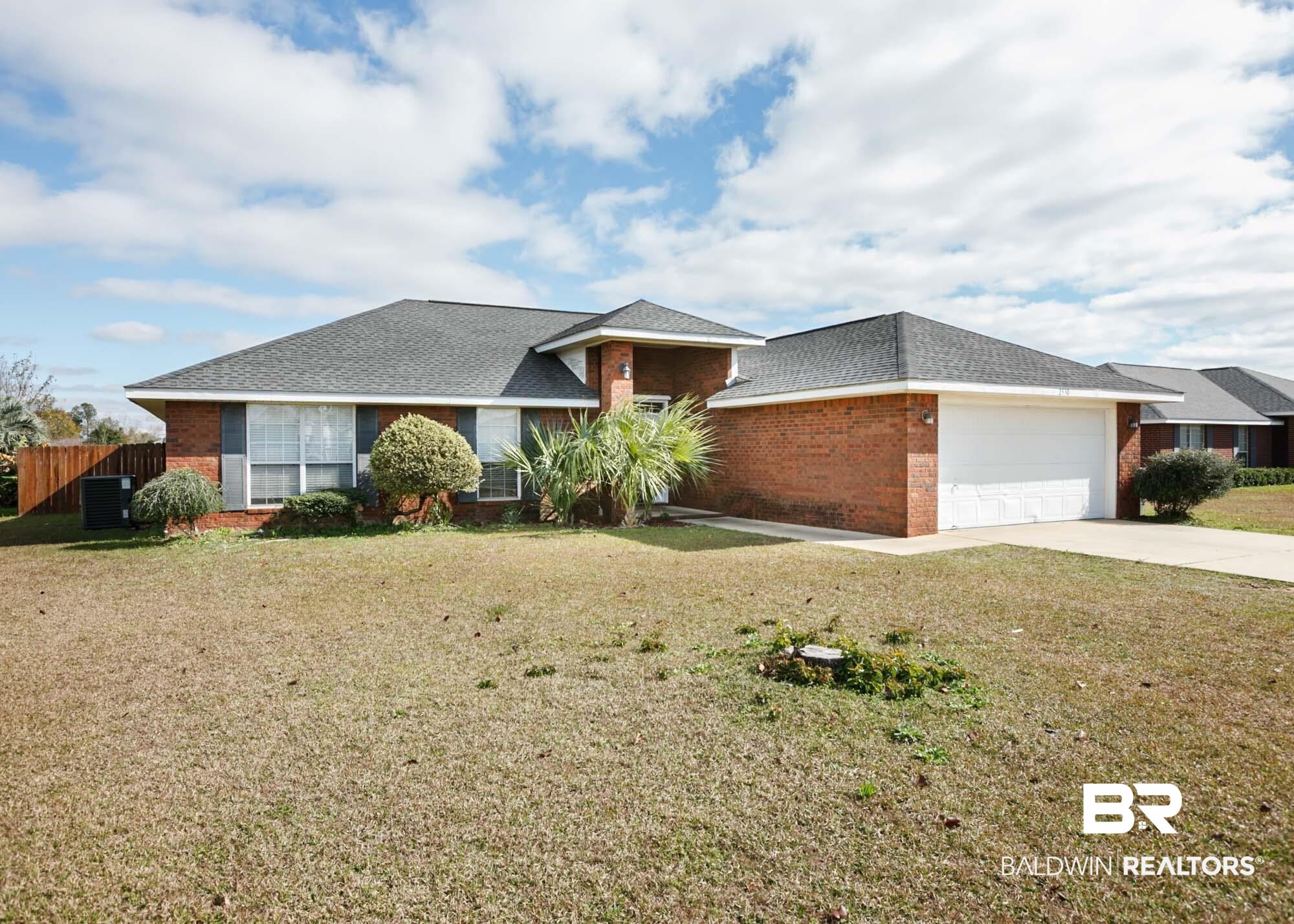 2530 Ashburn Lane Foley, AL 36535 - Photo 1 of 46 View of front of home featuring a garage, a front yard, and central AC