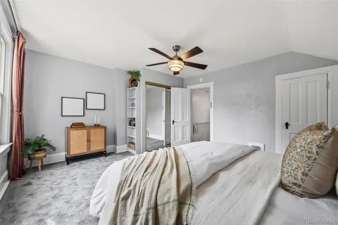 a bedroom with a bed and a couch