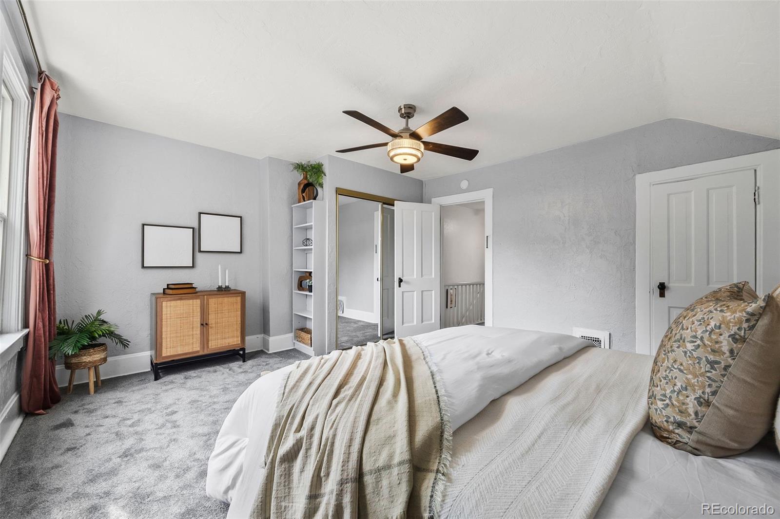 35 West Byers Place Denver, CO 80223 - Photo 17 of 31 a bedroom with a bed and a couch