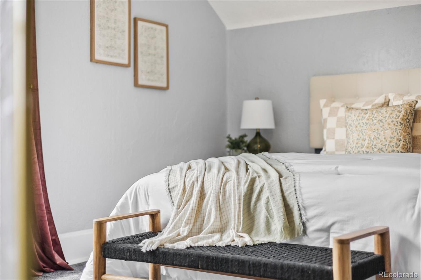 35 West Byers Place Denver, CO 80223 - Photo 18 of 31 a bedroom with a bed and a lamp