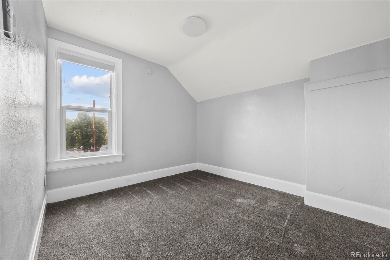 35 West Byers Place Denver, CO 80223 - Photo 21 of 31 an empty room with a window