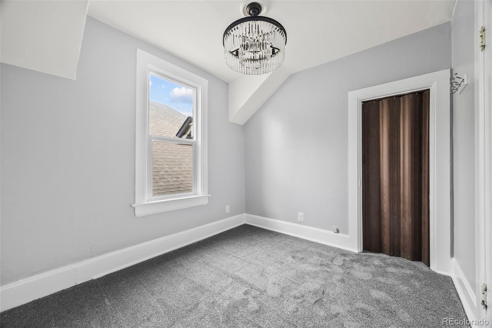 35 West Byers Place Denver, CO 80223 - Photo 22 of 31 an empty room with a window