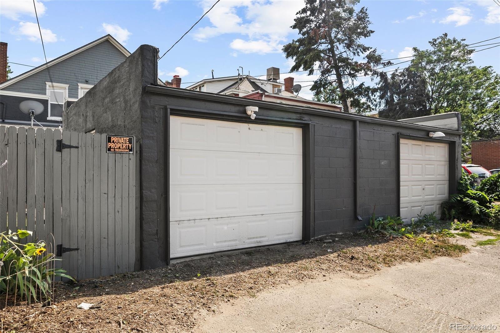 35 West Byers Place Denver, CO 80223 - Photo 27 of 31 a side view of a house with a tree