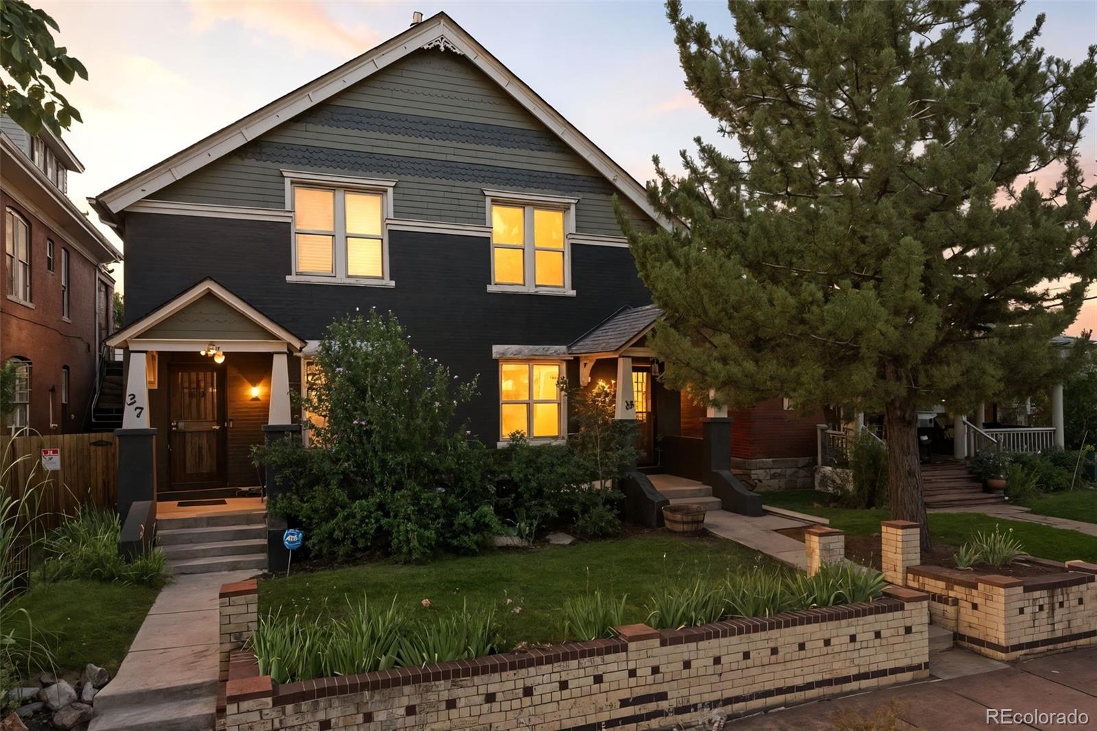 35 West Byers Place Denver, CO 80223 - Photo 28 of 31 a front view of a house with garden