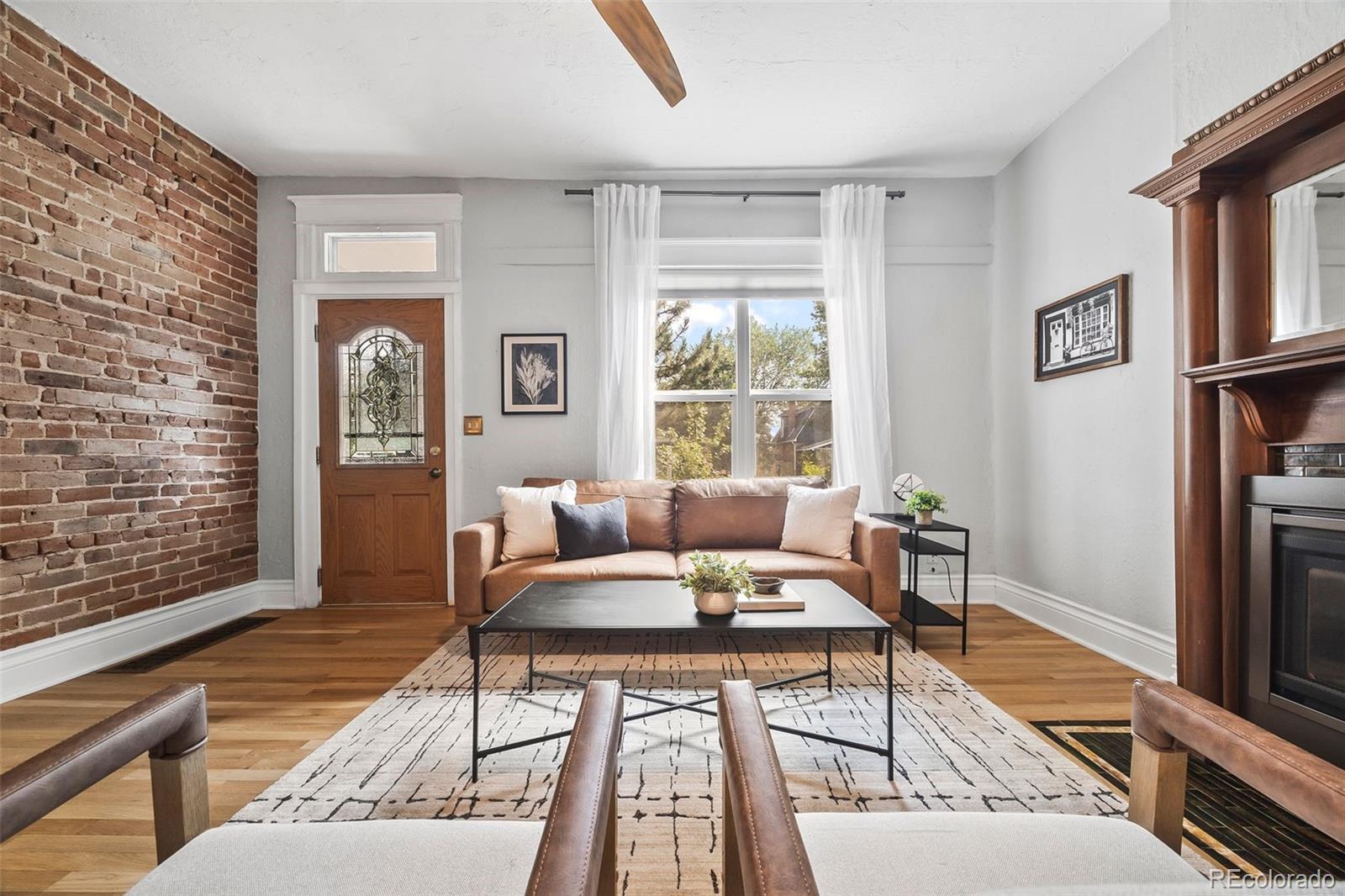 35 West Byers Place Denver, CO 80223 - Photo 7 of 31 a living room with furniture and a window