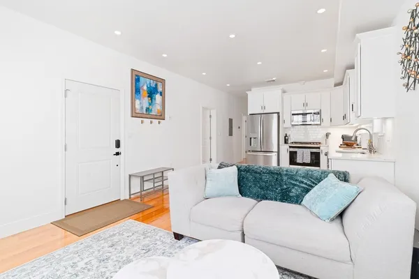 a living room with furniture and a rug