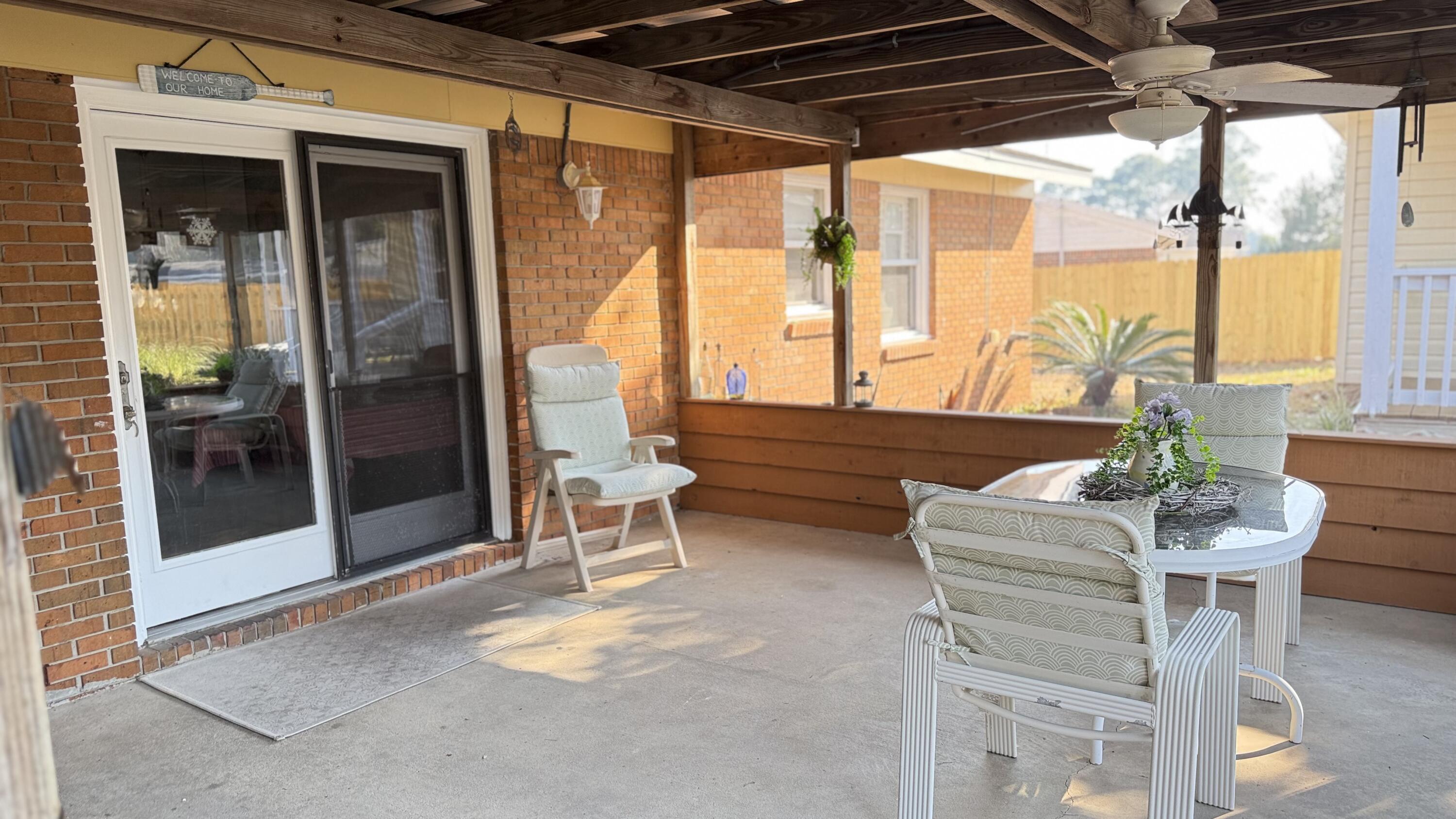 238 Martisa Road Northwest Fort Walton Beach, FL 32548 - Photo 30 of 48 a outdoor space with lots of furniture and windows