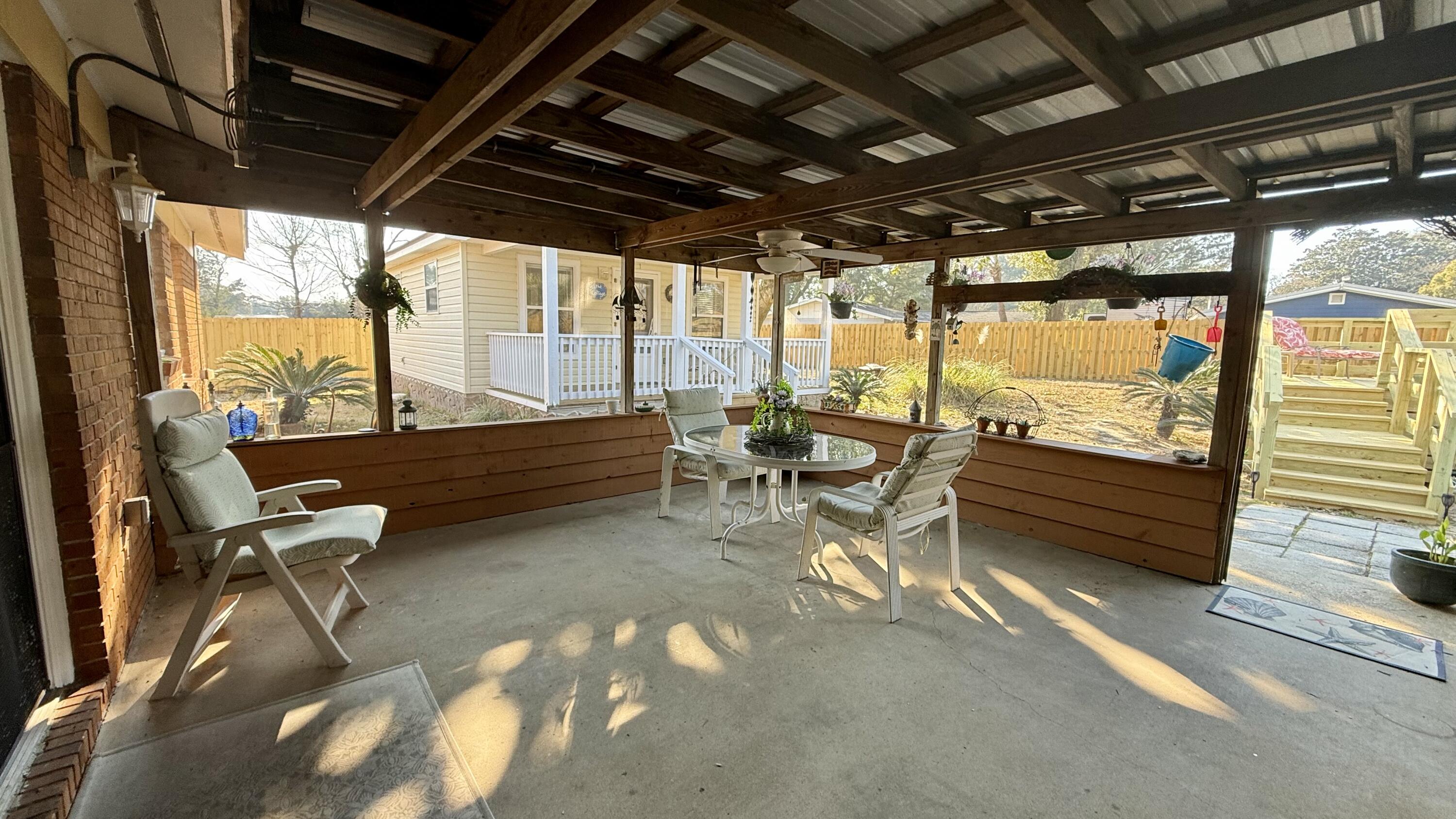 238 Martisa Road Northwest Fort Walton Beach, FL 32548 - Photo 31 of 48 a outdoor space with lots of furniture and glass door