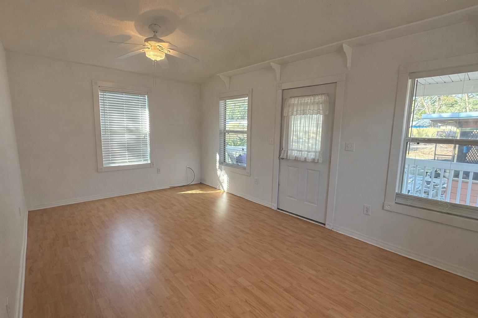 238 Martisa Road Northwest Fort Walton Beach, FL 32548 - Photo 39 of 48 a view of an empty room with a window and wooden floor