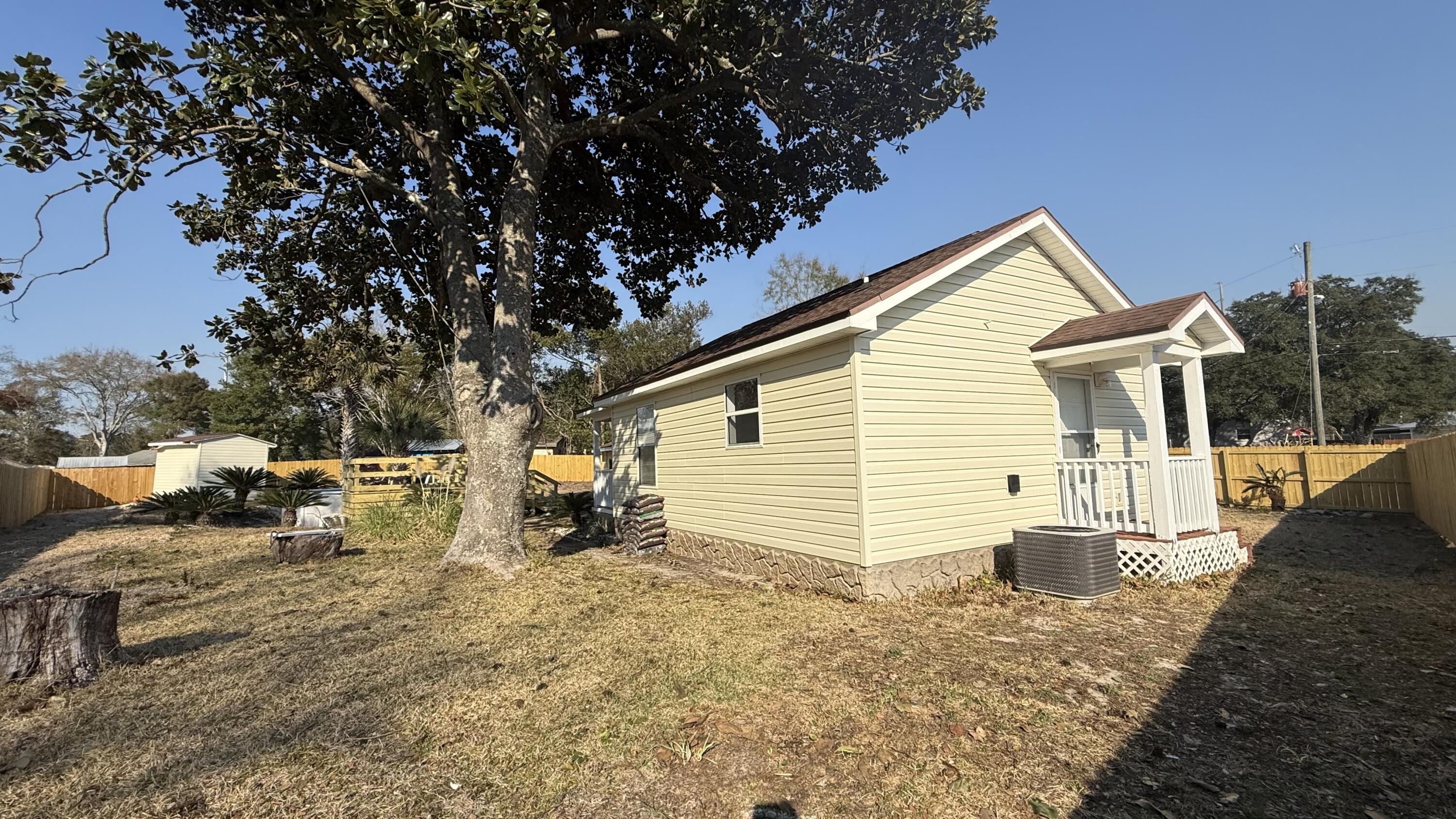 238 Martisa Road Northwest Fort Walton Beach, FL 32548 - Photo 47 of 48 a view of a house with backyard and sitting area