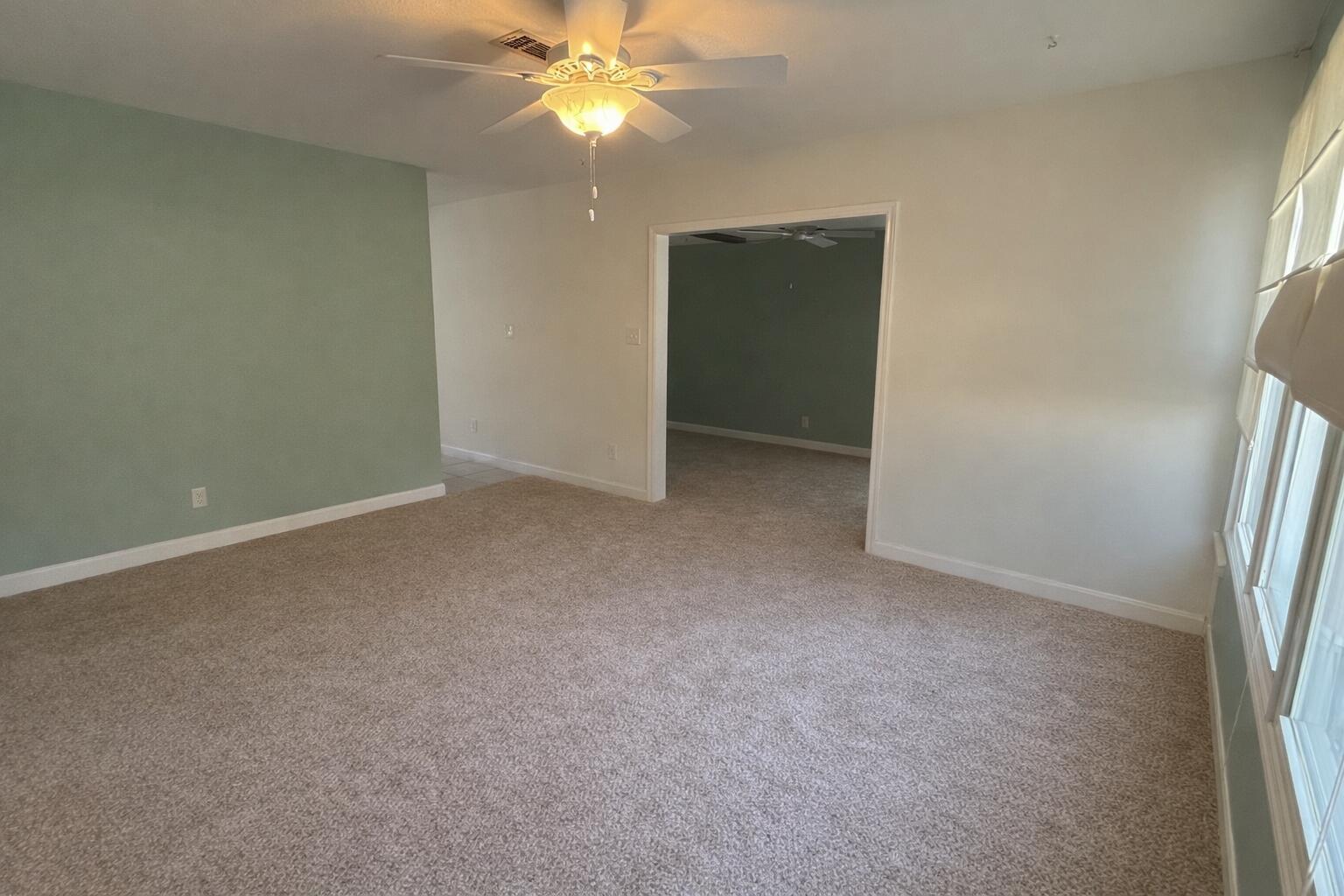 238 Martisa Road Northwest Fort Walton Beach, FL 32548 - Photo 6 of 48 an empty room with a fan and a fan