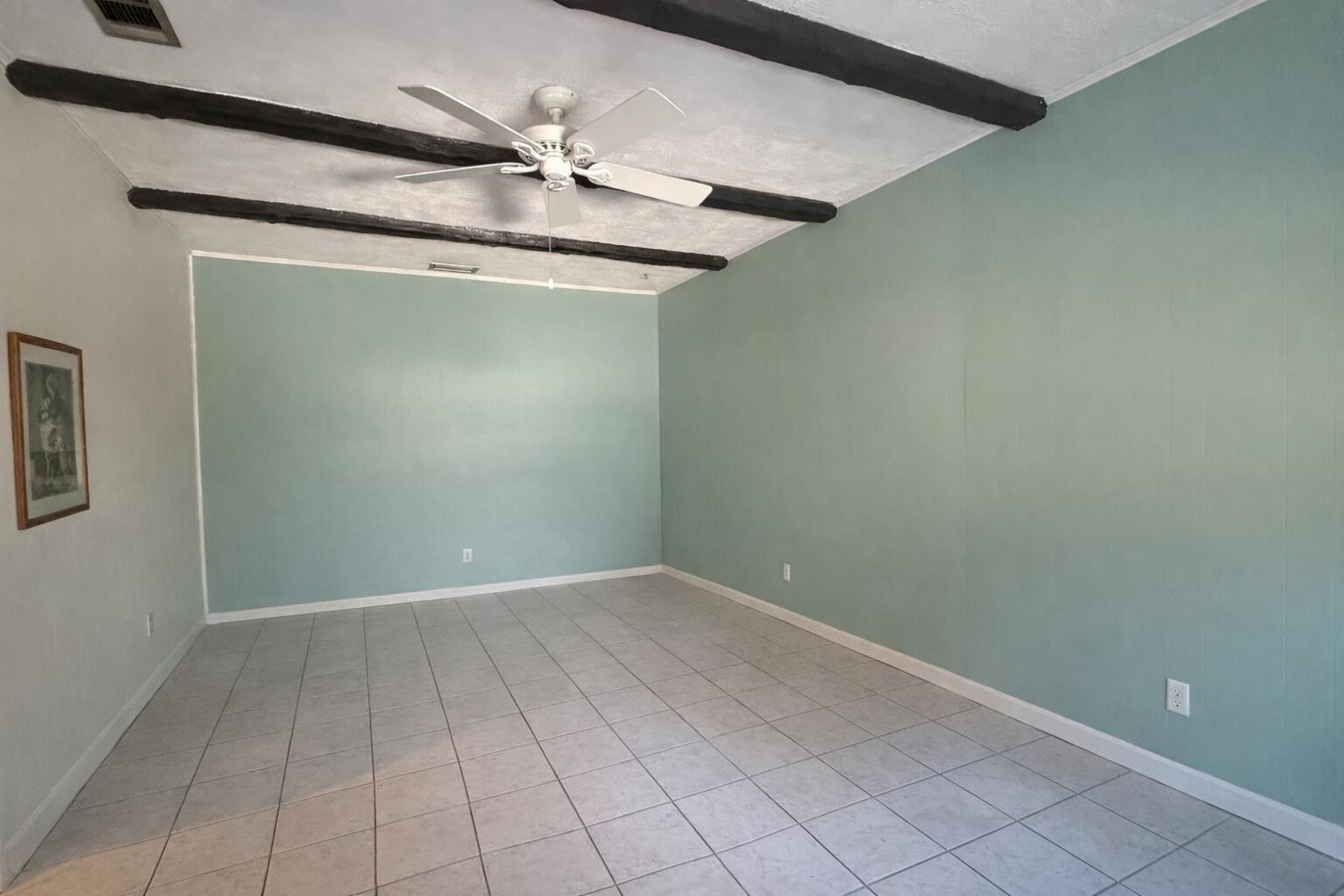 238 Martisa Road Northwest Fort Walton Beach, FL 32548 - Photo 8 of 48 a view of a room with an empty space and a ceiling fan