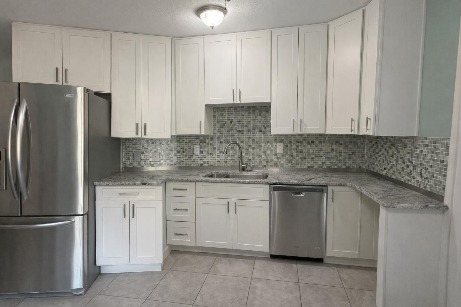 238 Martisa Road Northwest Fort Walton Beach, FL 32548 - Photo 9 of 48 a kitchen with stainless steel appliances granite countertop a stove a refrigerator and a white cabinets