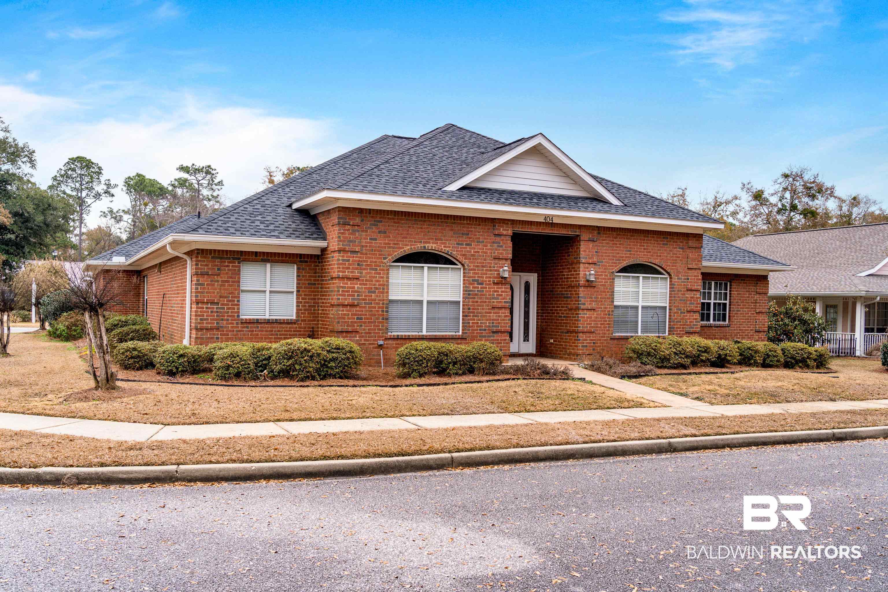 404 Savannah Lane Foley, AL 36535 - Photo 1 of 29 View of front of home with brick siding and roof with shingles