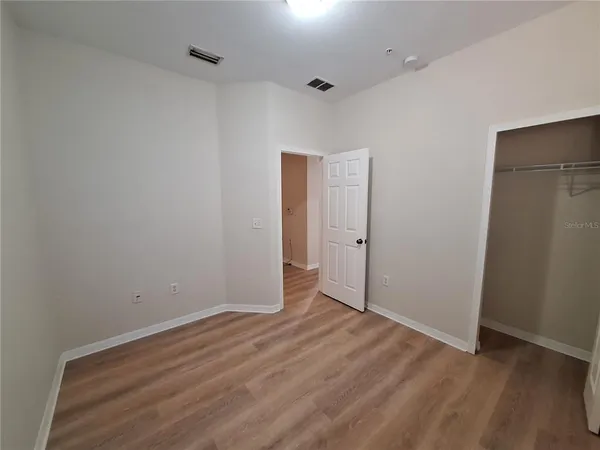 wooden floor with white walls