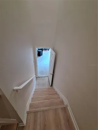 a room with water heater and stainless steel appliances