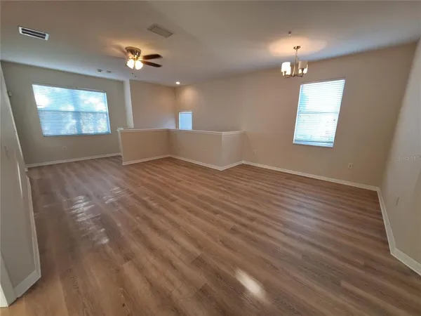 a kitchen with stainless steel appliances granite countertop a refrigerator and a stove