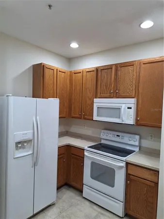 a utility room with a sink washer and dryer