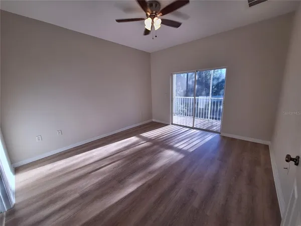 a bathroom with a sink a toilet and a large mirror