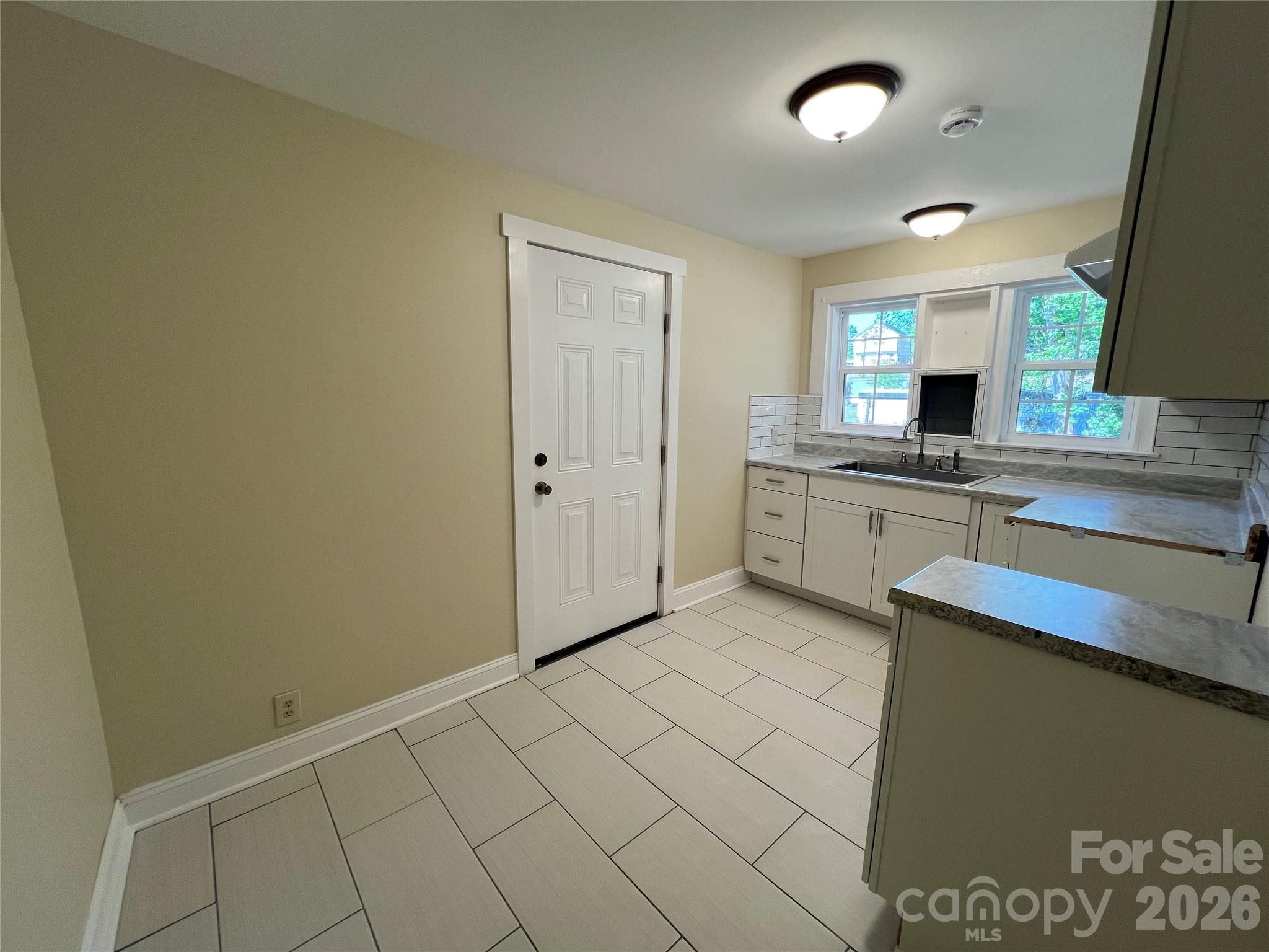511 Murphy Street Kannapolis, NC 28081 - Photo 12 of 23 a view of a kitchen with a sink and a dishwasher