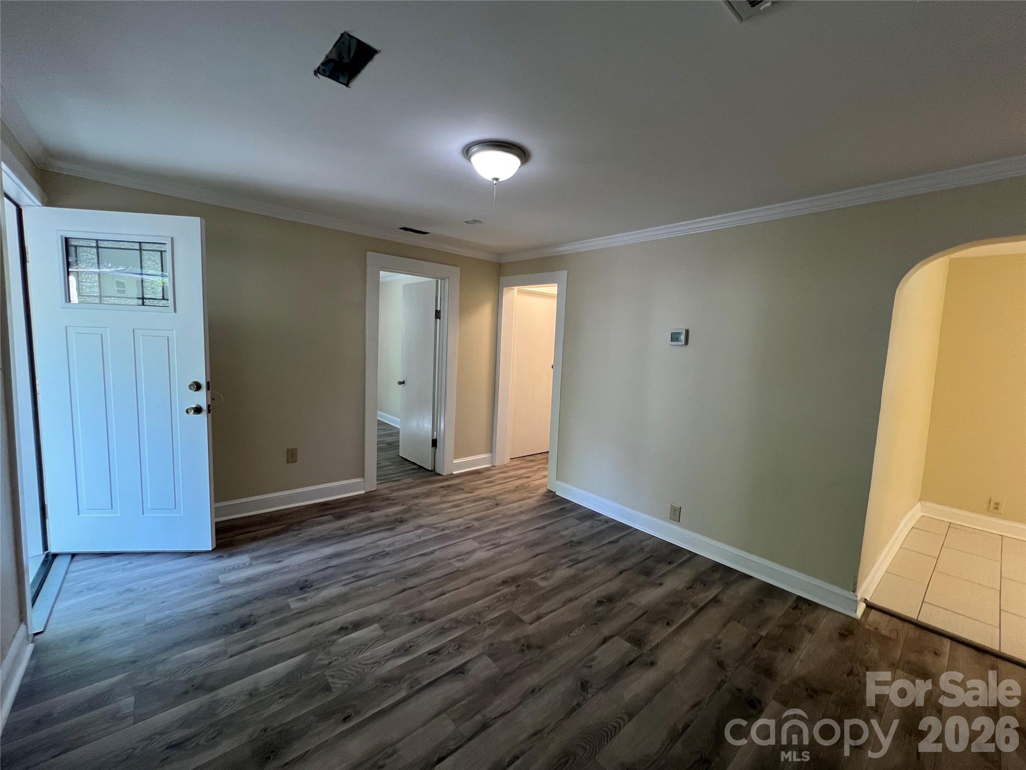 511 Murphy Street Kannapolis, NC 28081 - Photo 17 of 23 an empty room with wooden floor and windows