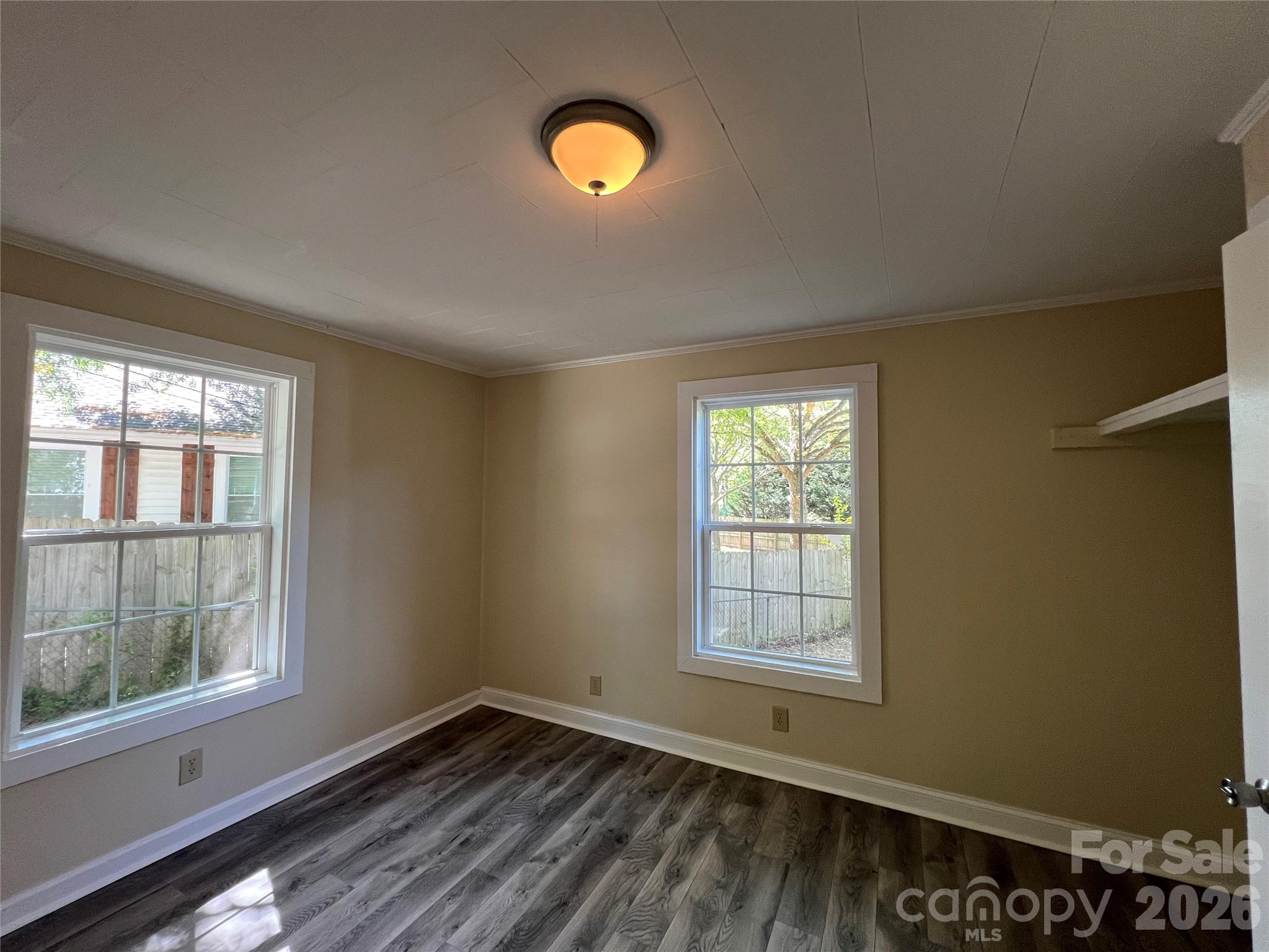 511 Murphy Street Kannapolis, NC 28081 - Photo 19 of 23 a view of an empty room with wooden floor and a window