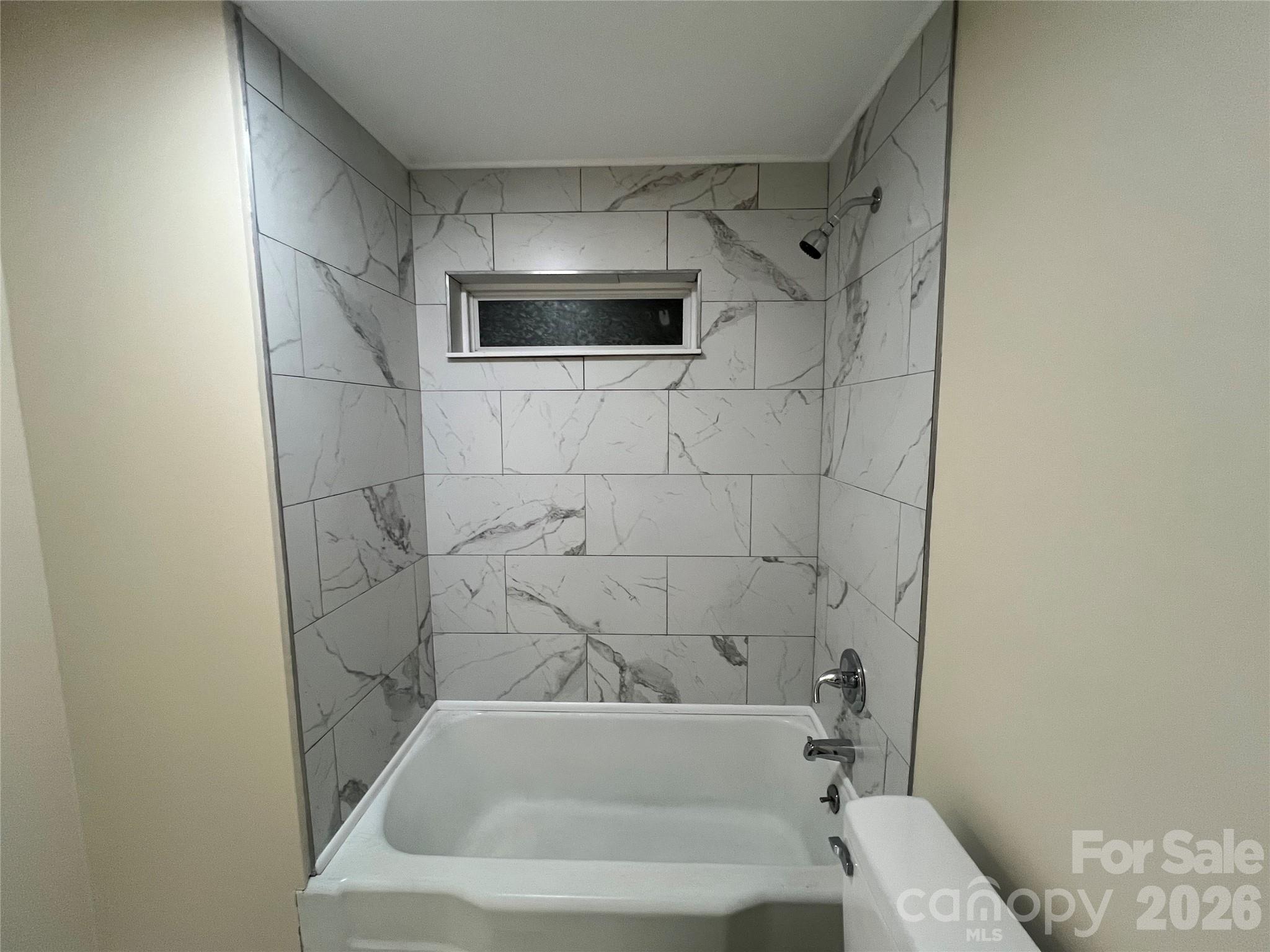 511 Murphy Street Kannapolis, NC 28081 - Photo 22 of 23 a bathroom with a bathtub and a shower