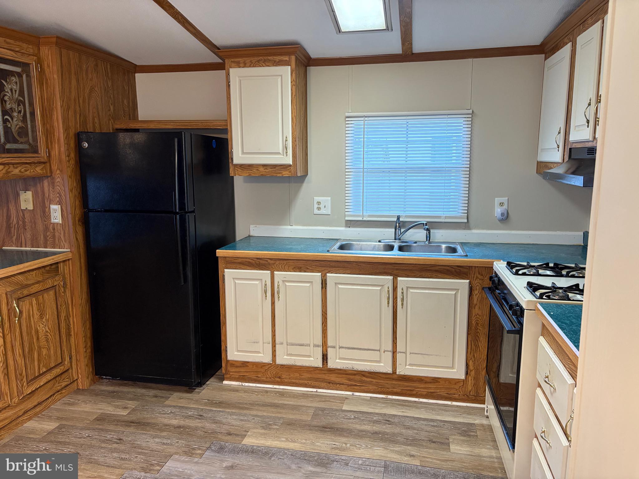 1021 Barberry Avenue, Unit T67 Reading, PA 19605 - Photo 2 of 10 a kitchen with a refrigerator and a sink