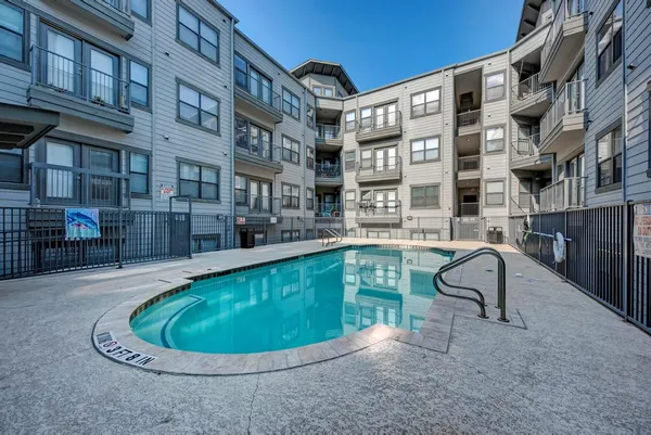 a view of a swimming pool with a lounge chair