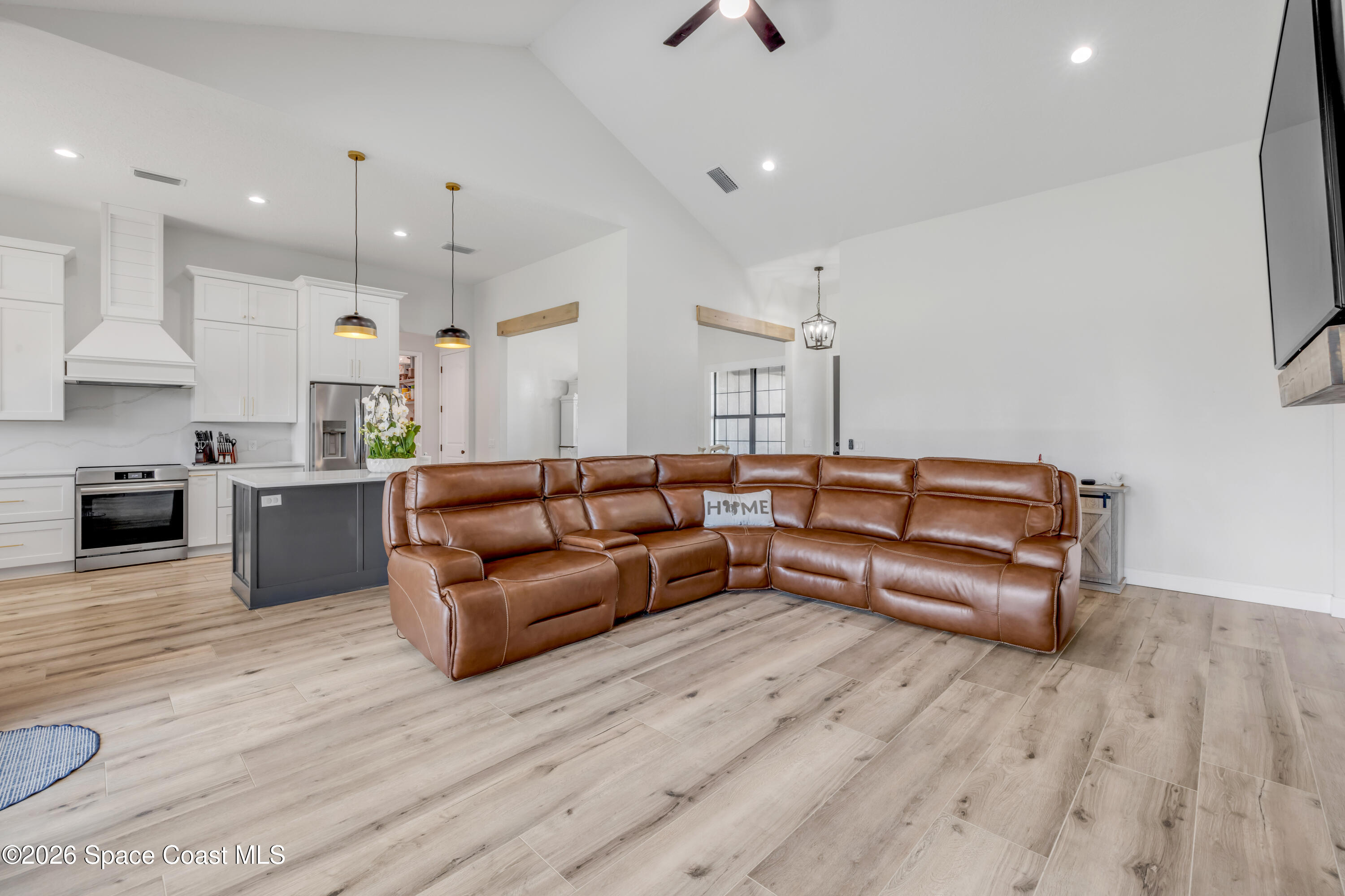 3395 Dunn Road Mims, FL 32754 - Photo 11 of 40 a living room with furniture and a wooden floor