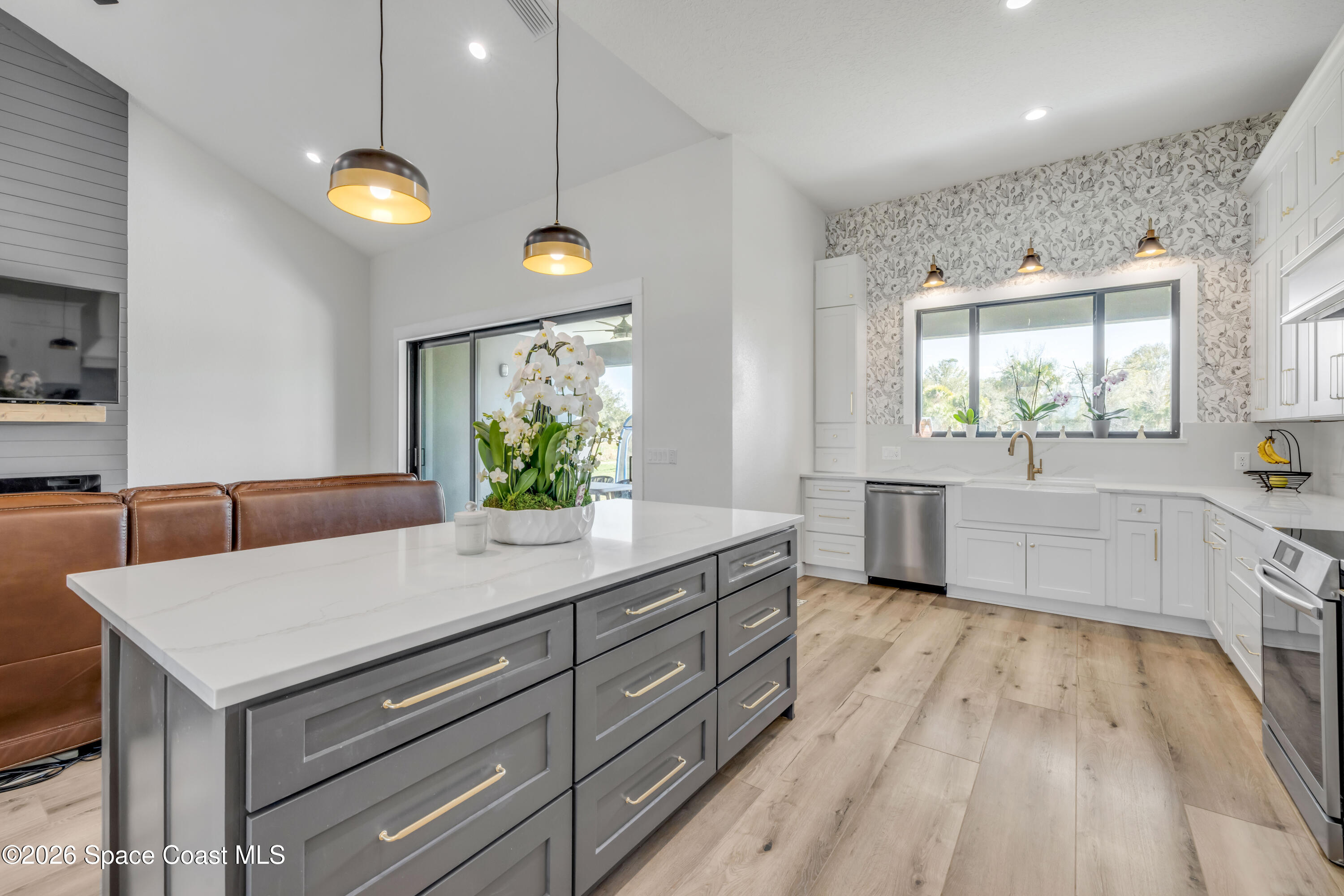 3395 Dunn Road Mims, FL 32754 - Photo 14 of 40 a kitchen with a sink and wooden floor