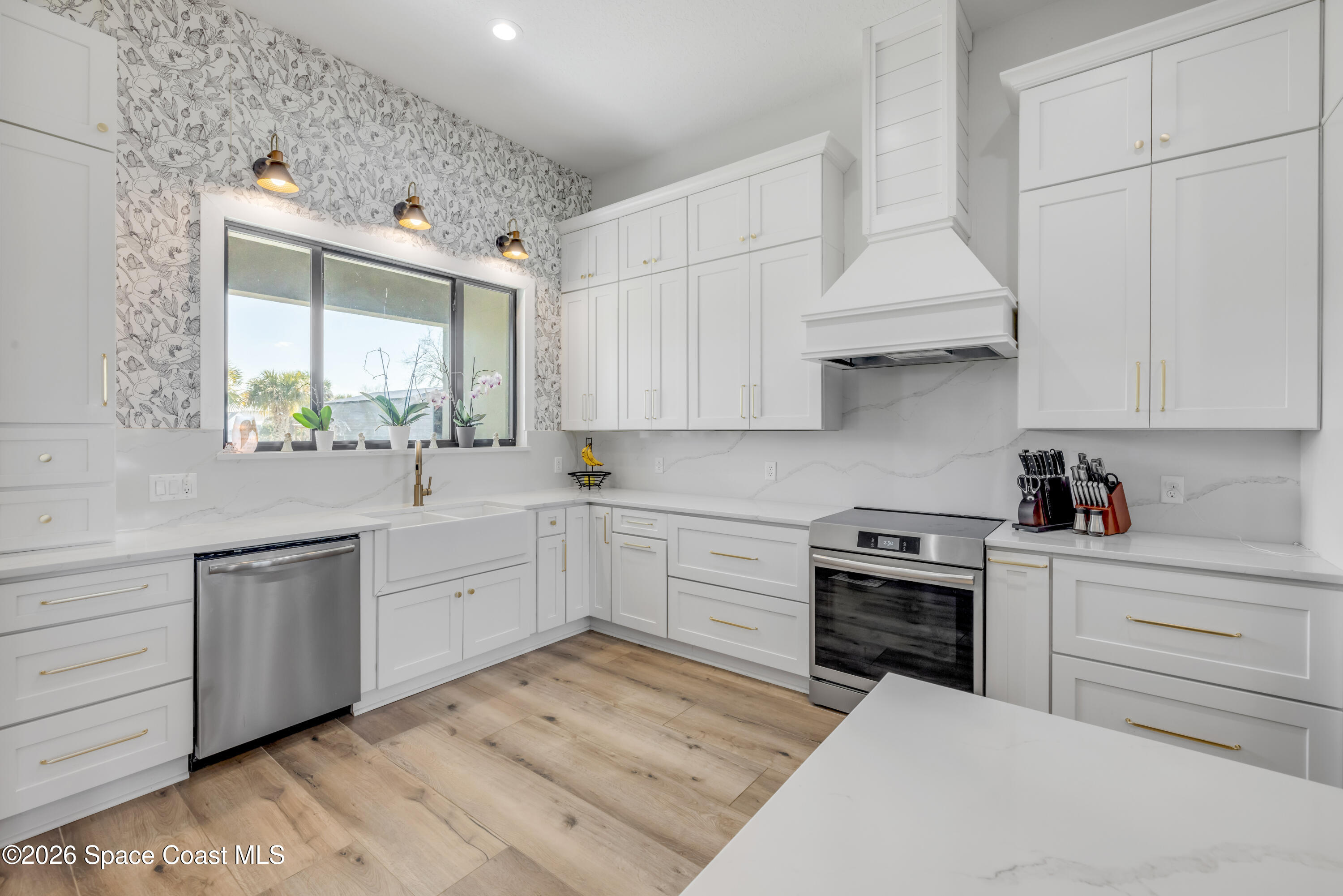 3395 Dunn Road Mims, FL 32754 - Photo 15 of 40 a kitchen with cabinets appliances and a window