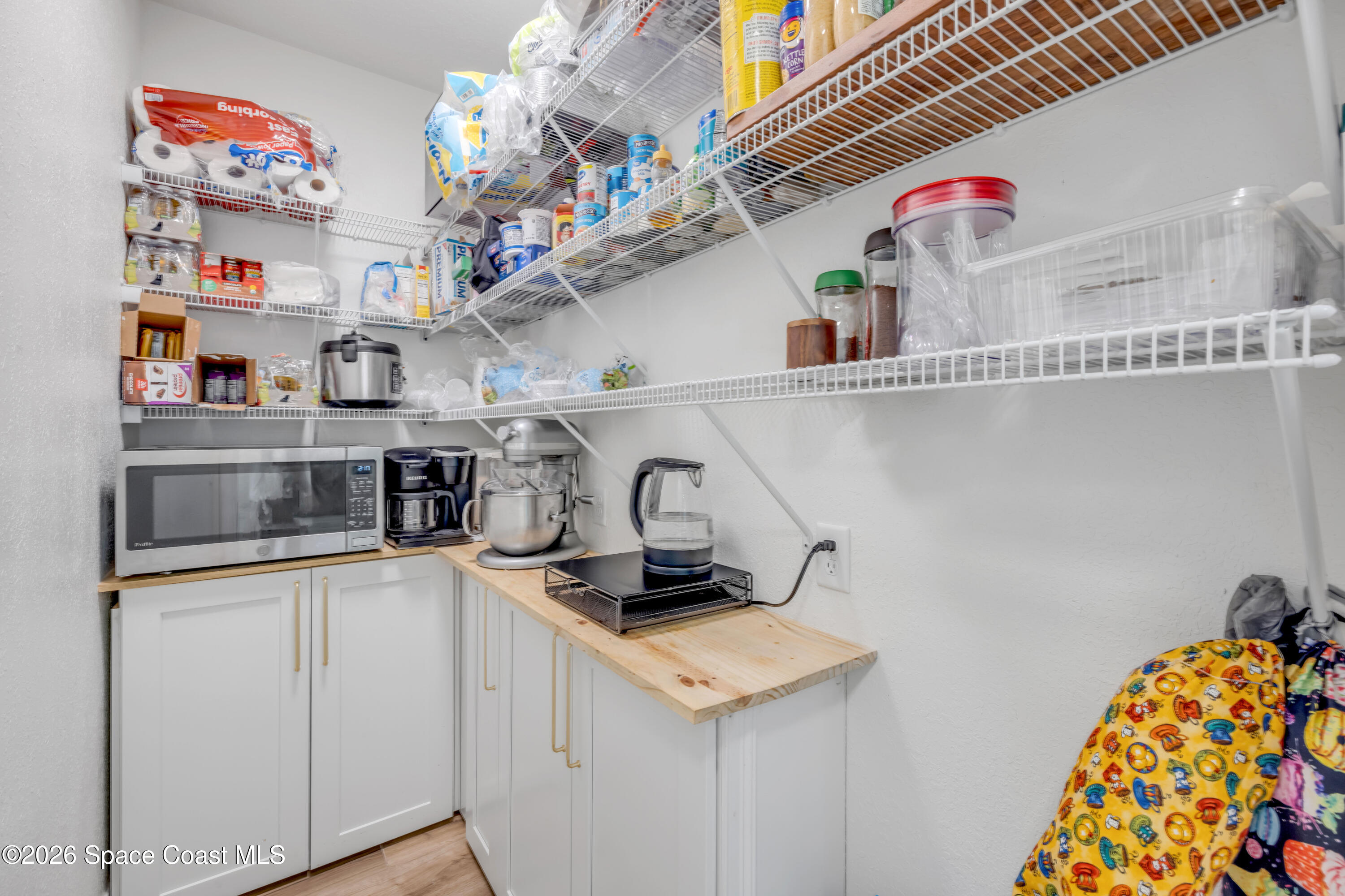 3395 Dunn Road Mims, FL 32754 - Photo 18 of 40 a kitchen with stainless steel appliances granite countertop a sink and a microwave