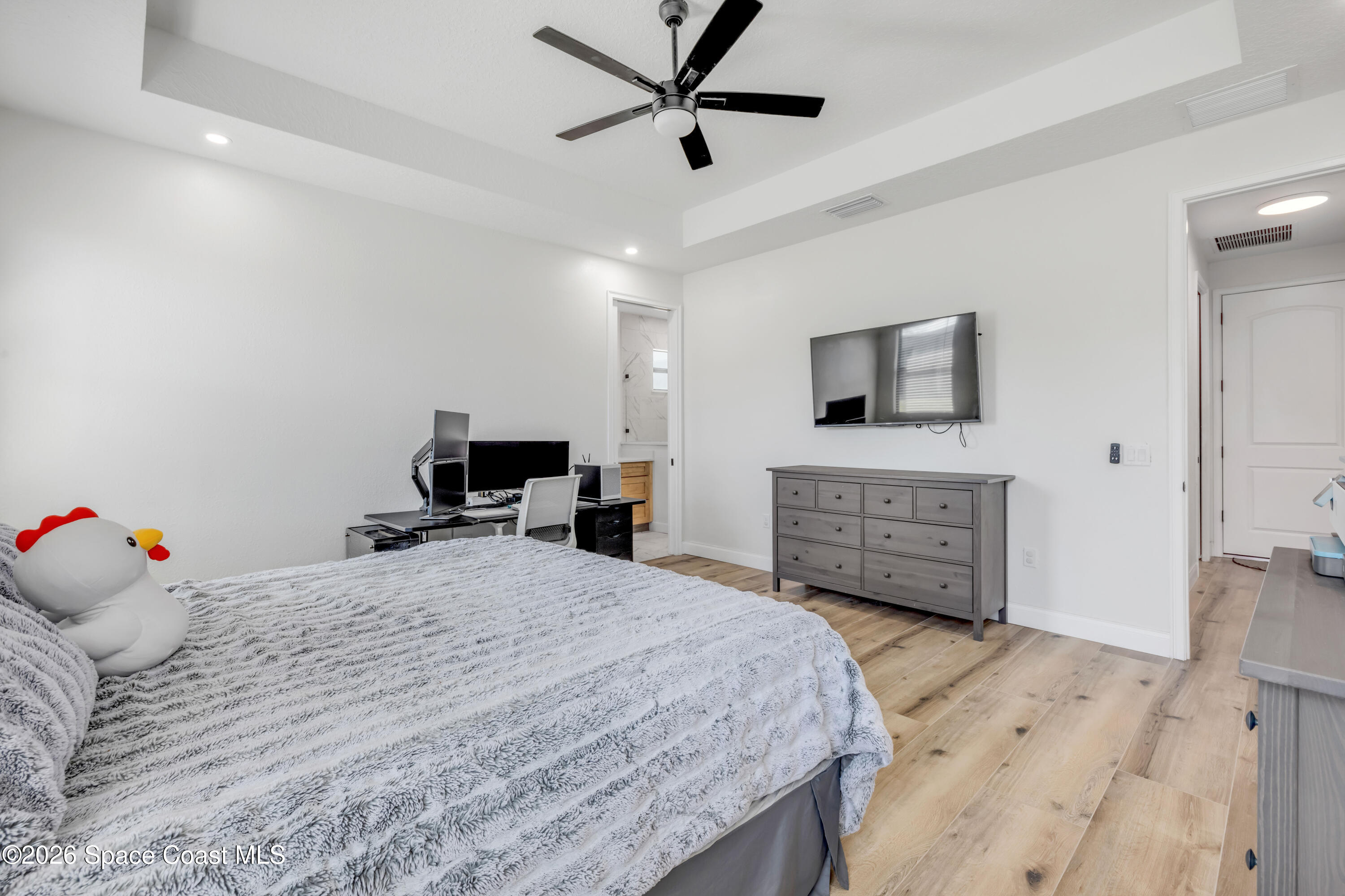 3395 Dunn Road Mims, FL 32754 - Photo 20 of 40 a bedroom with a bed and a television