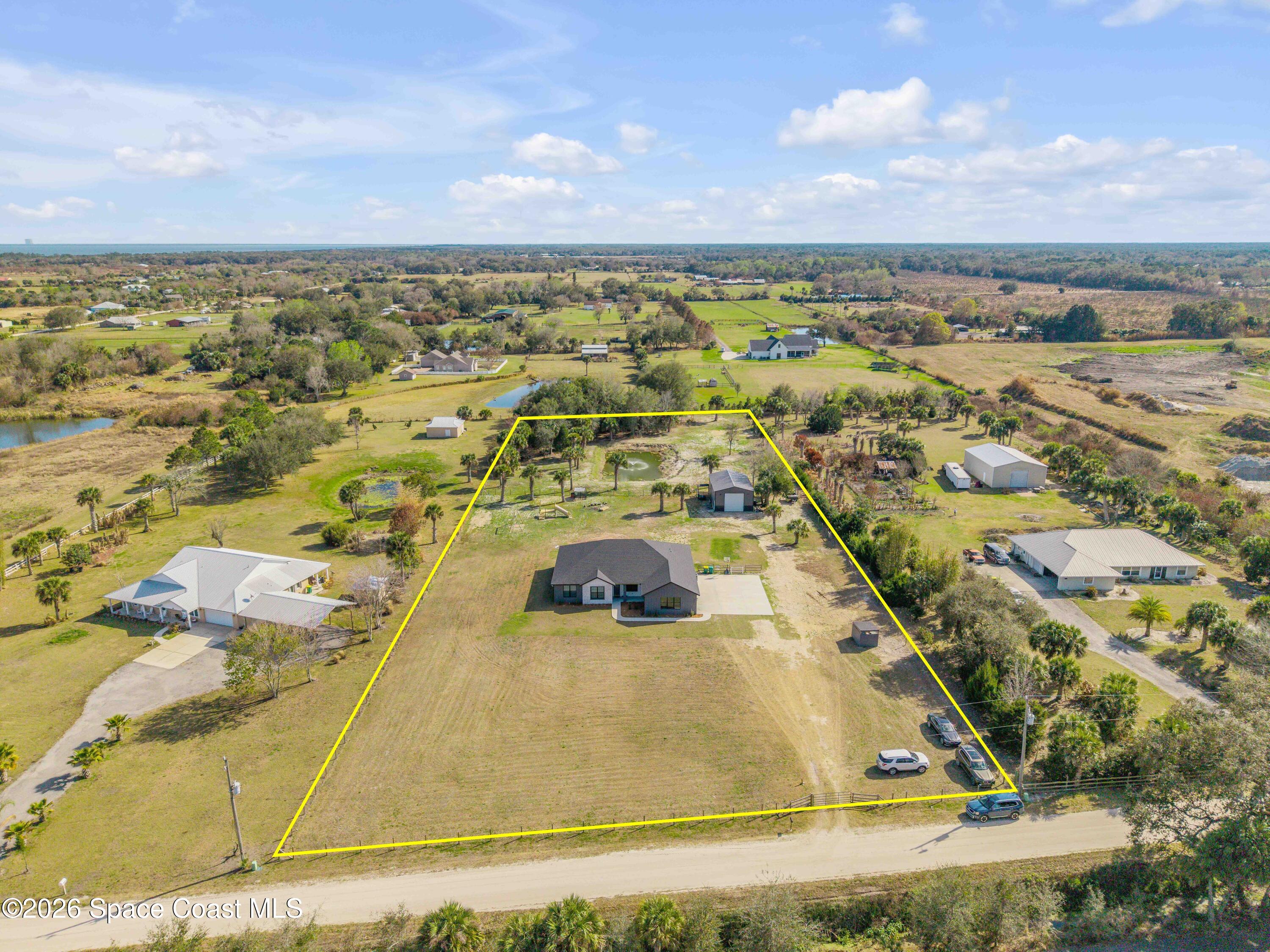 3395 Dunn Road Mims, FL 32754 - Photo 2 of 40 an aerial view of residential houses with outdoor space