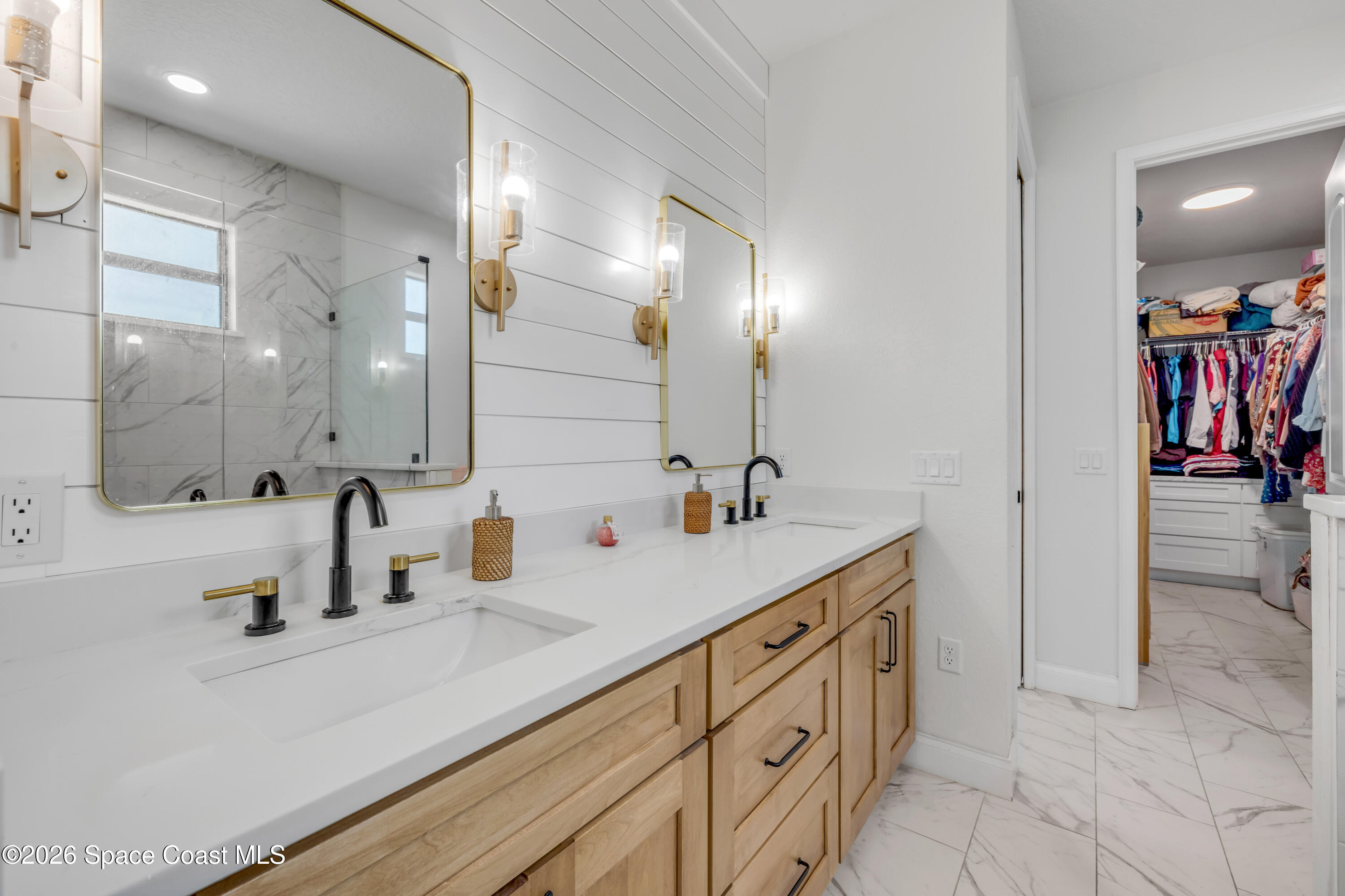 3395 Dunn Road Mims, FL 32754 - Photo 21 of 40 a bathroom with double vanity sink and a mirror