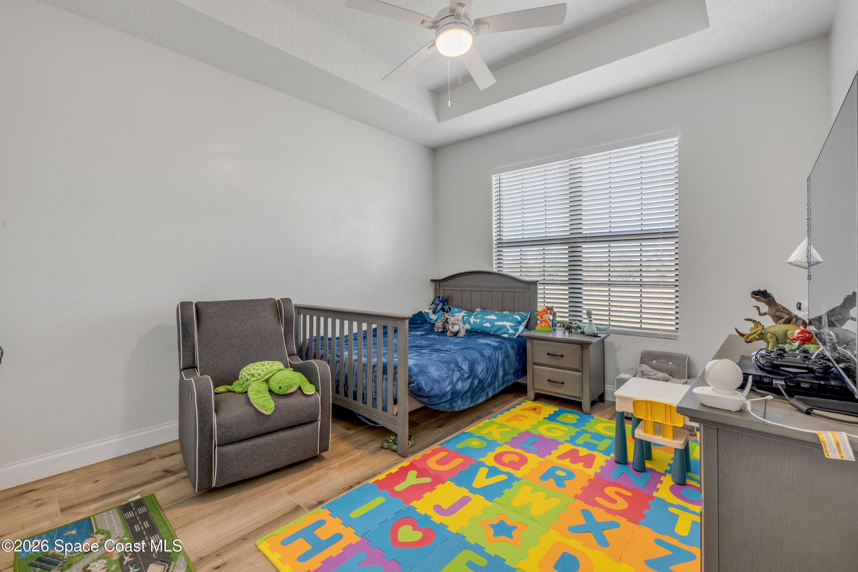 3395 Dunn Road Mims, FL 32754 - Photo 23 of 40 a living room with furniture and a wooden floor
