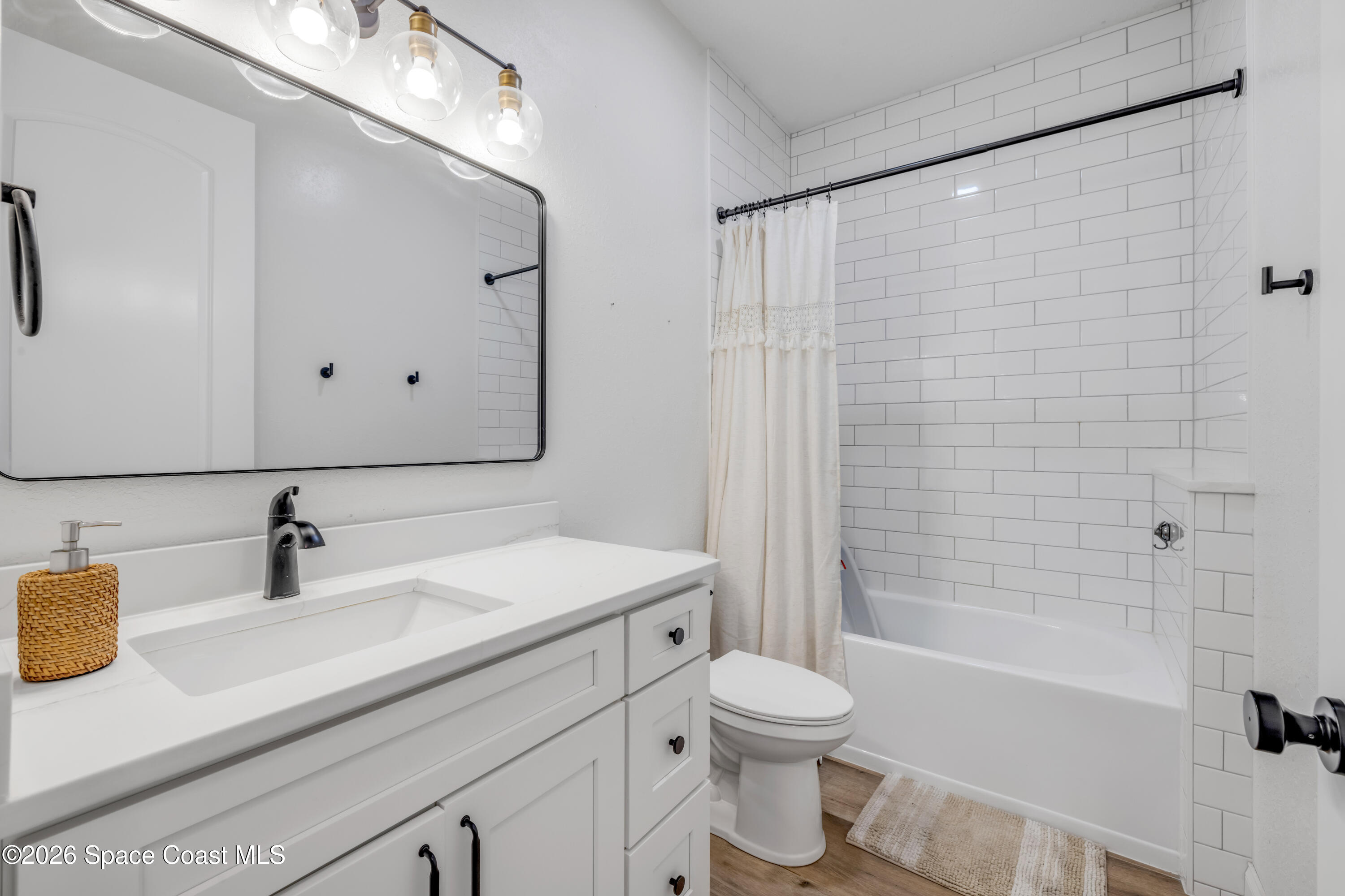 3395 Dunn Road Mims, FL 32754 - Photo 24 of 40 a bathroom with a sink a toilet and shower