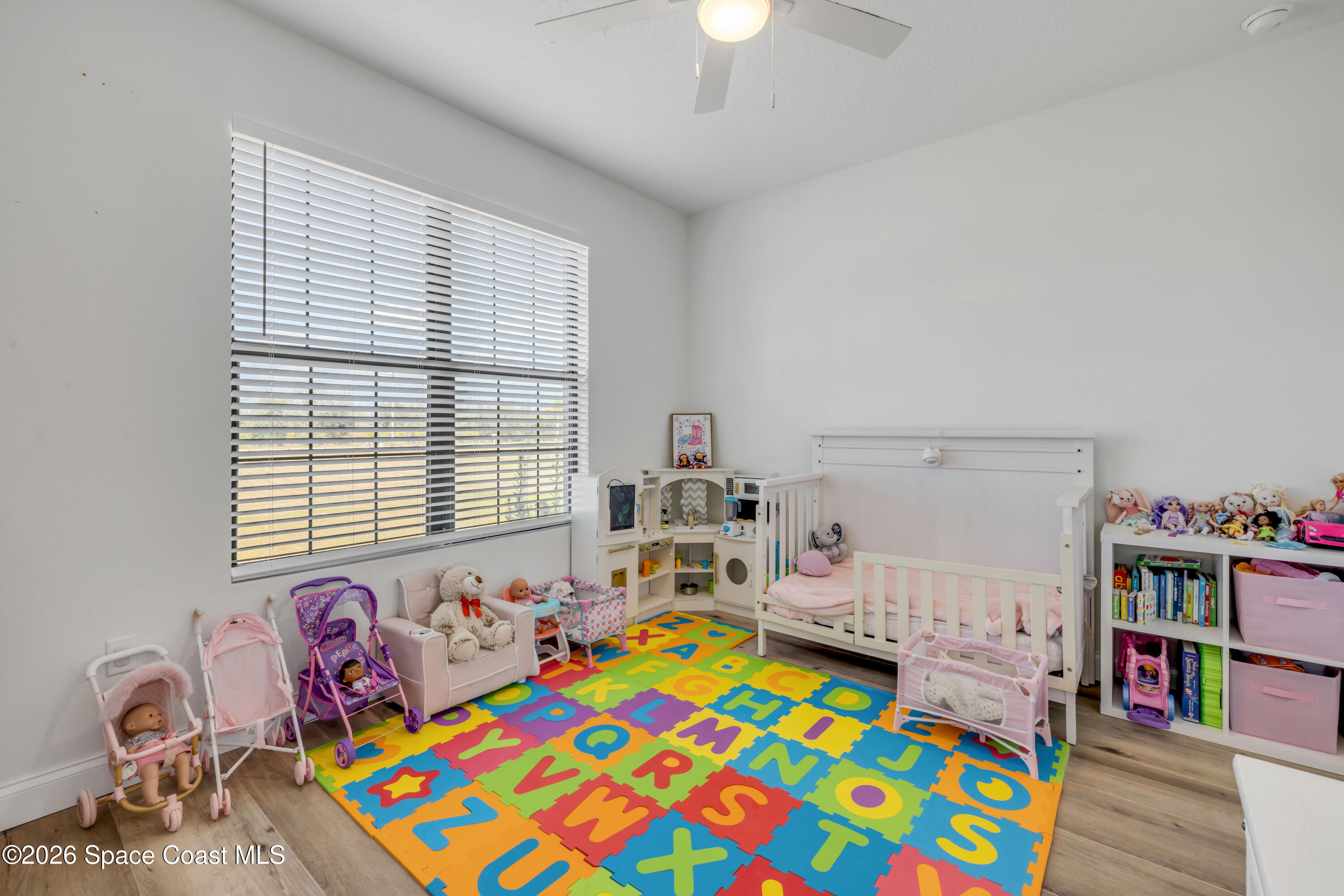 3395 Dunn Road Mims, FL 32754 - Photo 25 of 40 a bedroom with bed and a wooden floor