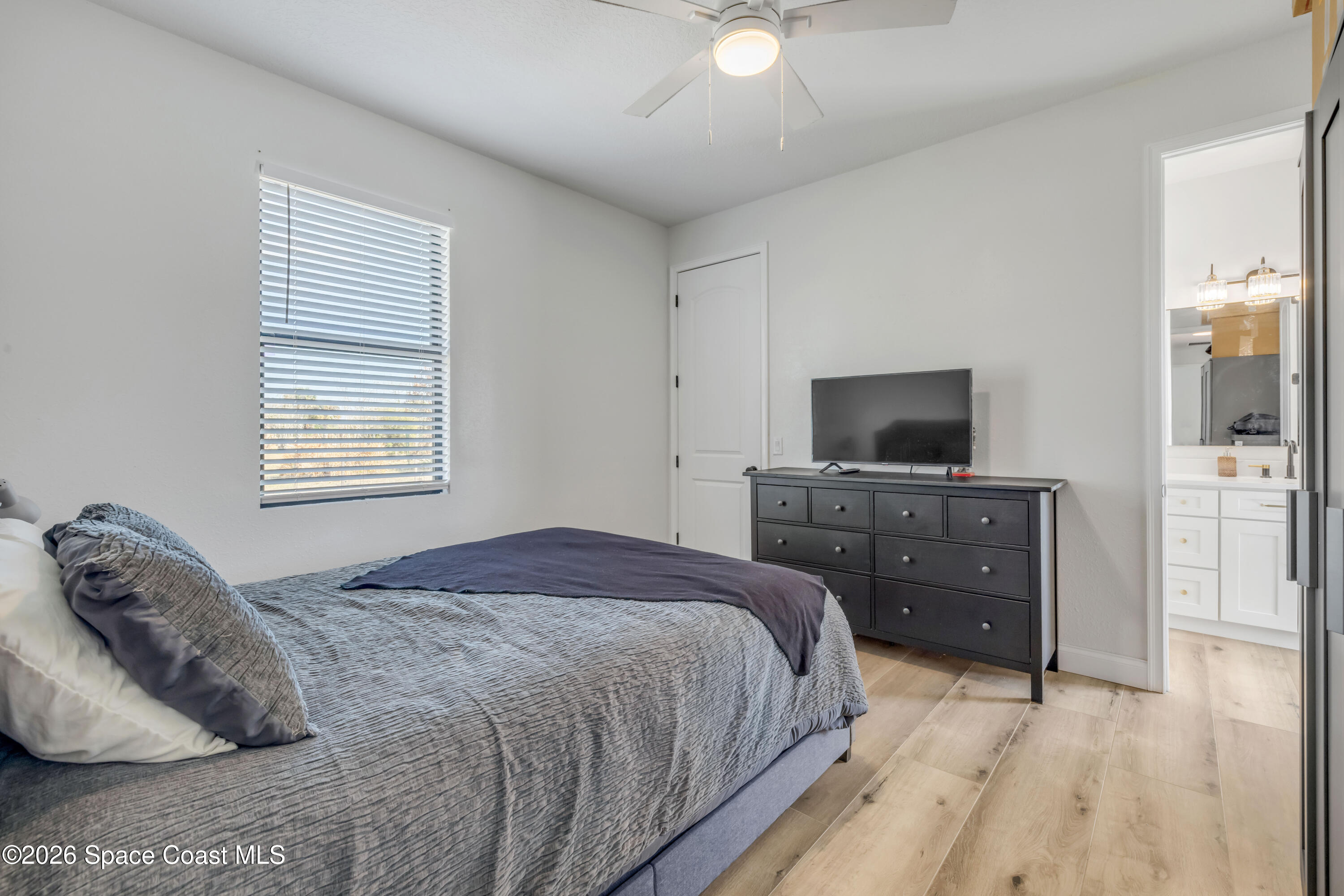 3395 Dunn Road Mims, FL 32754 - Photo 27 of 40 a bedroom with a bed and a flat screen tv
