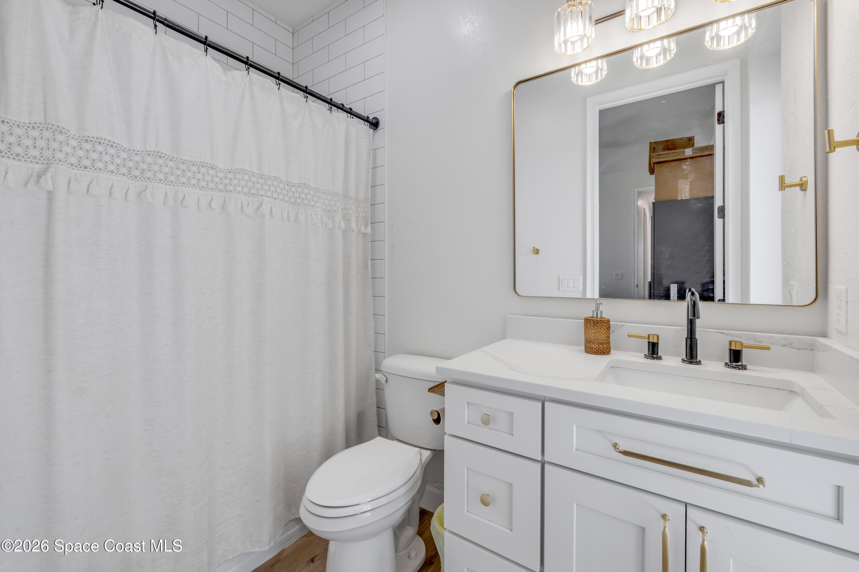 3395 Dunn Road Mims, FL 32754 - Photo 28 of 40 a bathroom with a granite countertop toilet sink and mirror