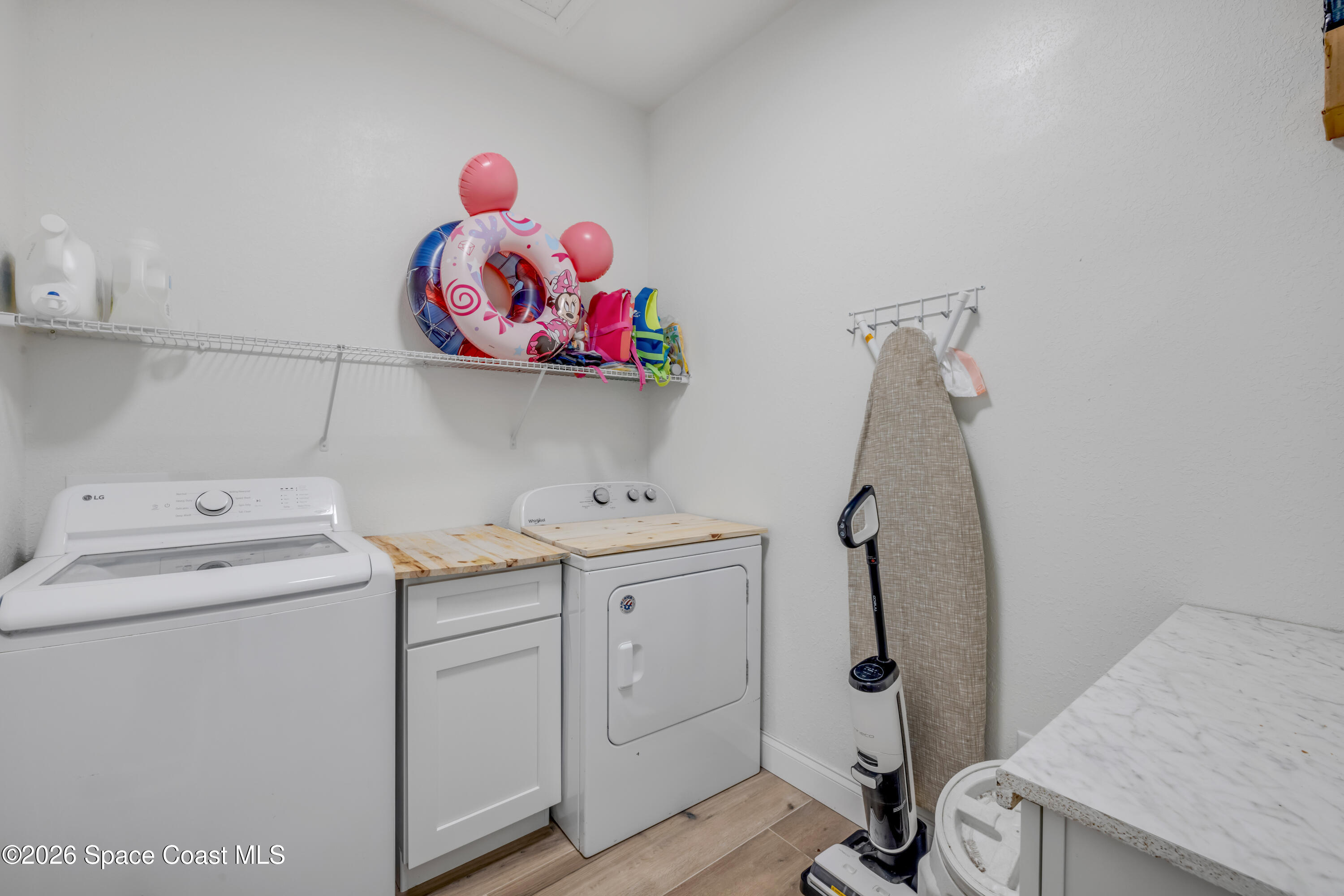 3395 Dunn Road Mims, FL 32754 - Photo 29 of 40 a view of storage and utility room with washer and dryer