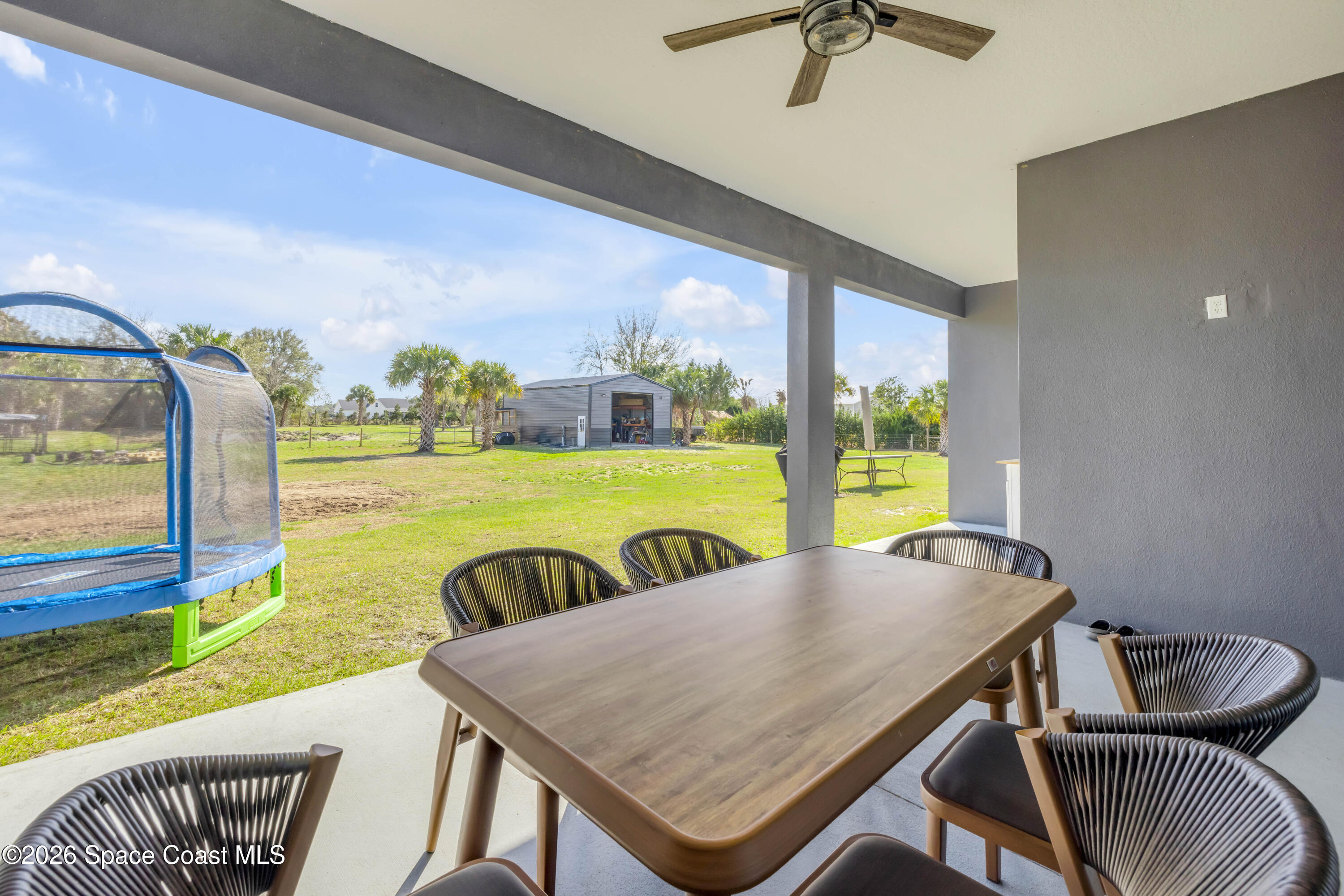 3395 Dunn Road Mims, FL 32754 - Photo 31 of 40 a view of a dining room with furniture window and outside view