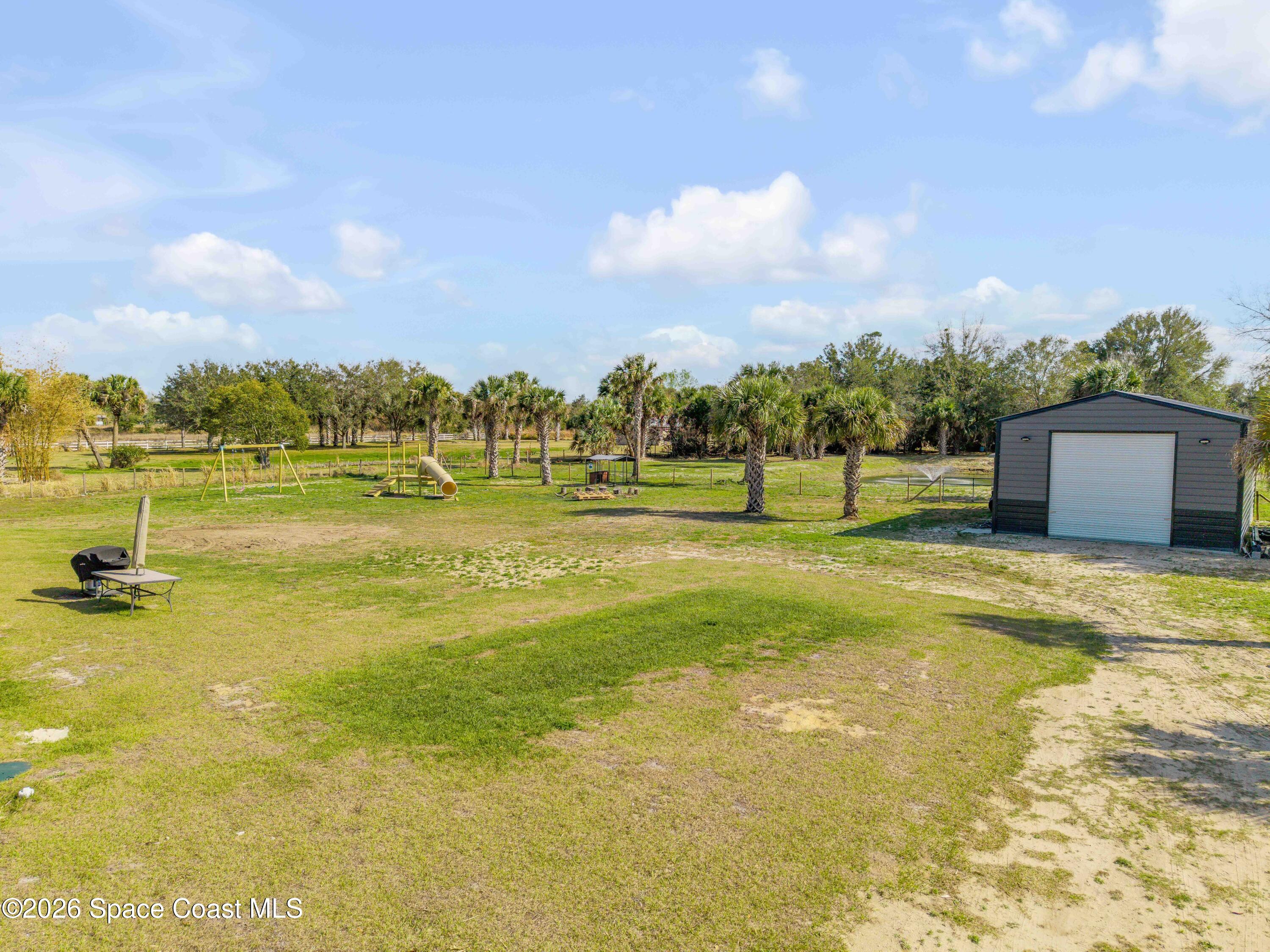 3395 Dunn Road Mims, FL 32754 - Photo 32 of 40 a view of an ocean beach and an ocean
