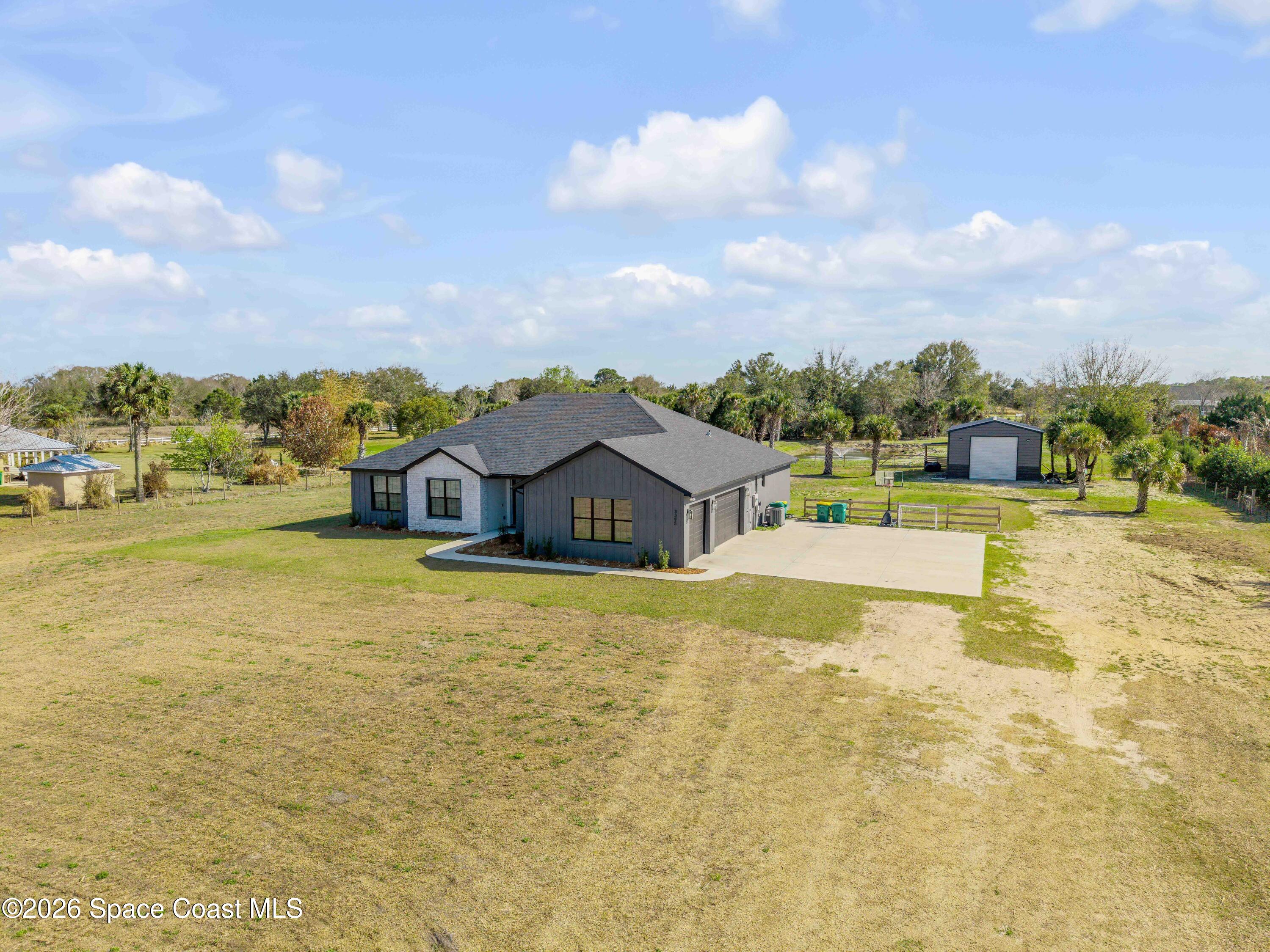 3395 Dunn Road Mims, FL 32754 - Photo 5 of 40 a view of a house with a yard