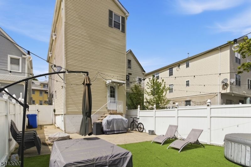 32 Cedar Avenue Elizabeth, NJ 07202 - Photo 32 of 32 a balcony with table and chairs