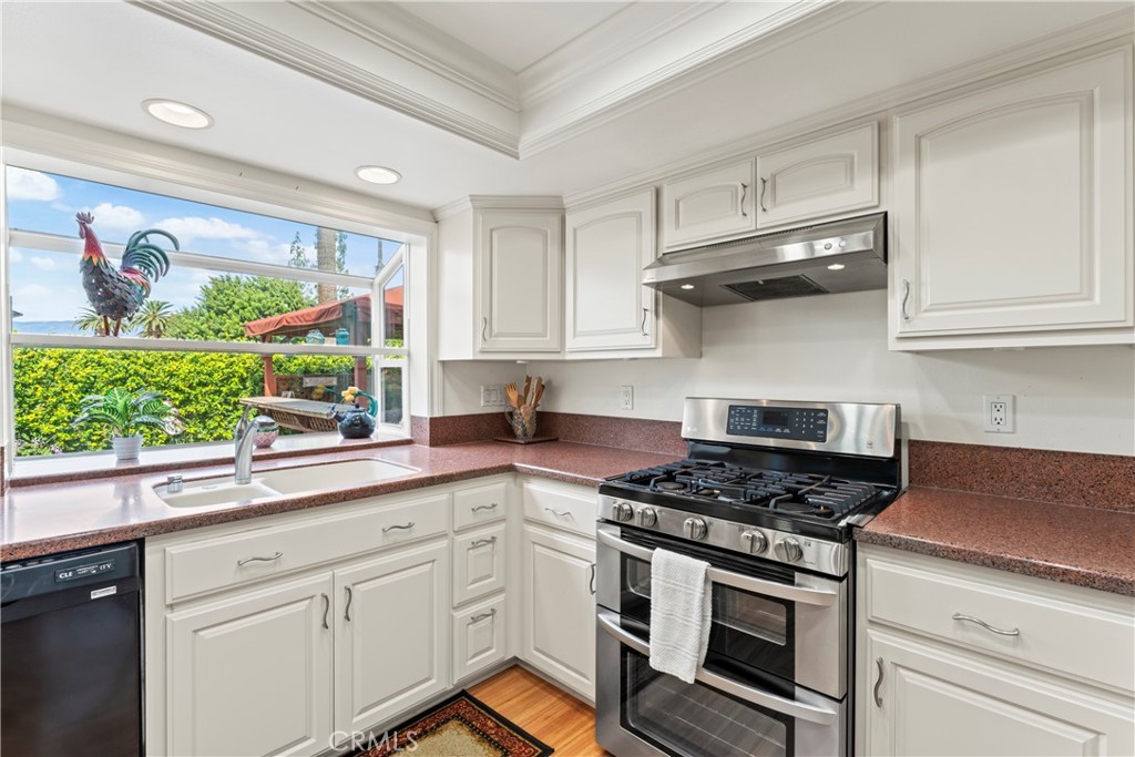 1749 Parkview Redlands, CA 92374 - Photo 14 of 55 a kitchen with stainless steel appliances white cabinets and a stove