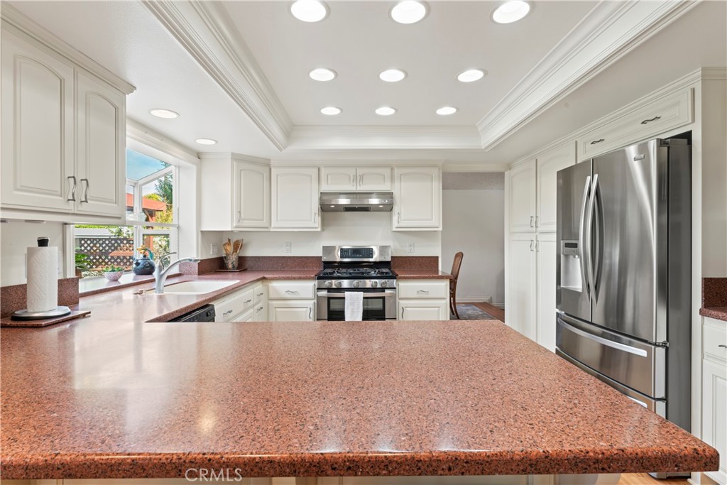 1749 Parkview Redlands, CA 92374 - Photo 17 of 55 a kitchen with stainless steel appliances granite countertop a stove refrigerator sink and cabinets