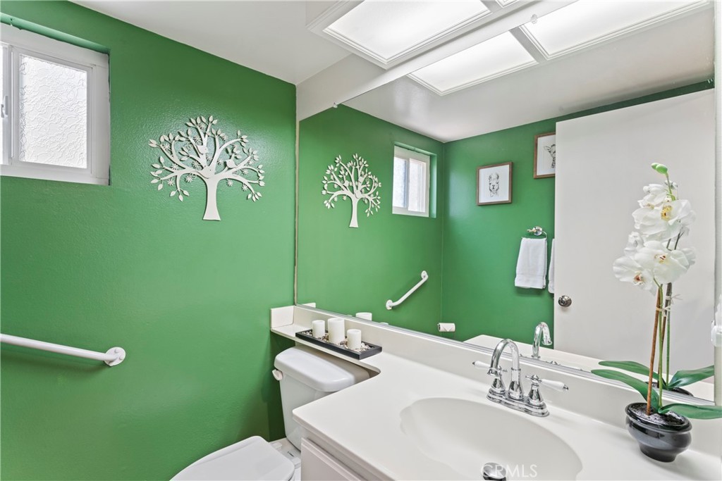 1749 Parkview Redlands, CA 92374 - Photo 22 of 55 a bathroom with a sink mirror and toilet