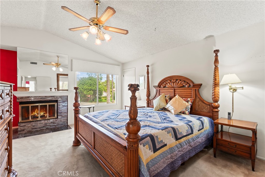 1749 Parkview Redlands, CA 92374 - Photo 25 of 55 a bed room with a bed and a fireplace